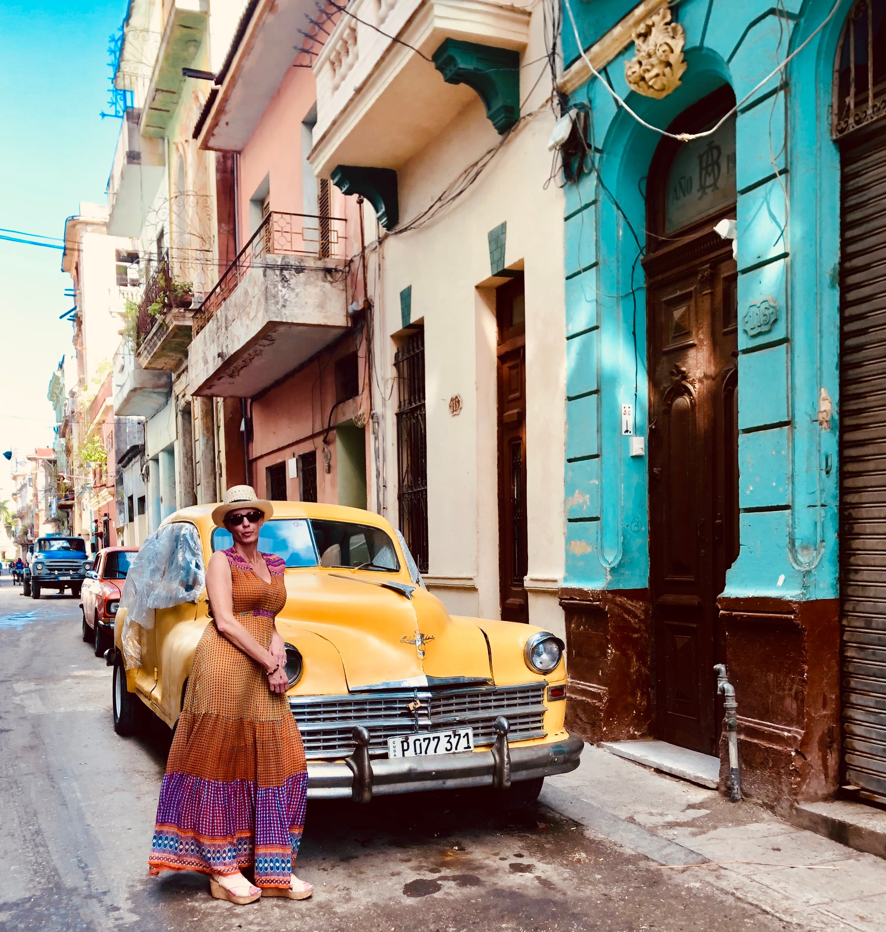 Posing with a yellow car