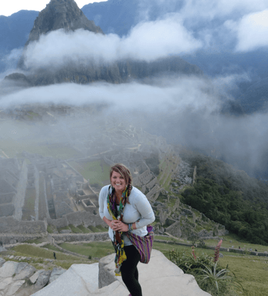 Posing for a photo at the Historic Sanctuary of Machu Picchu