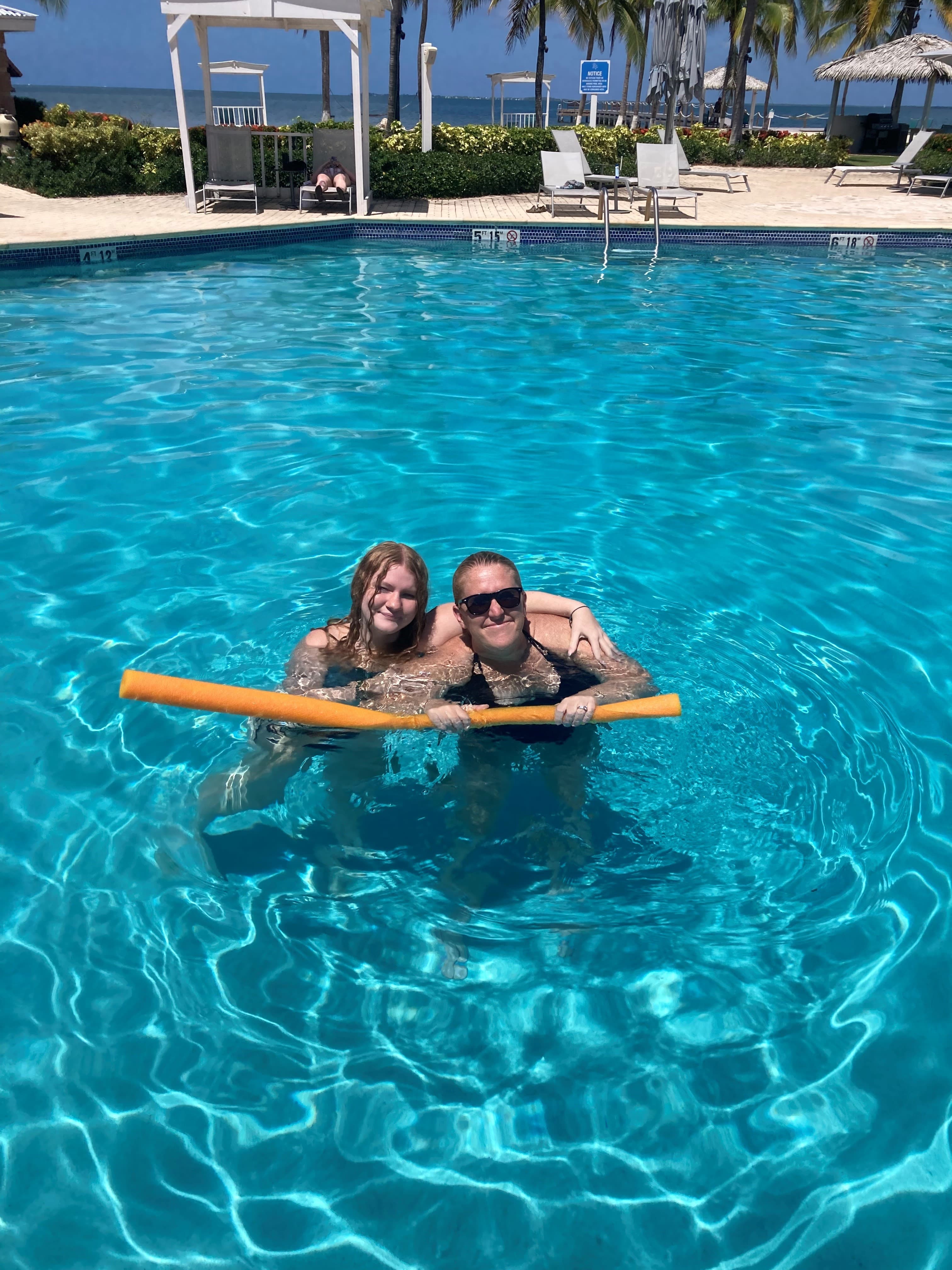 Couple posing in a pool