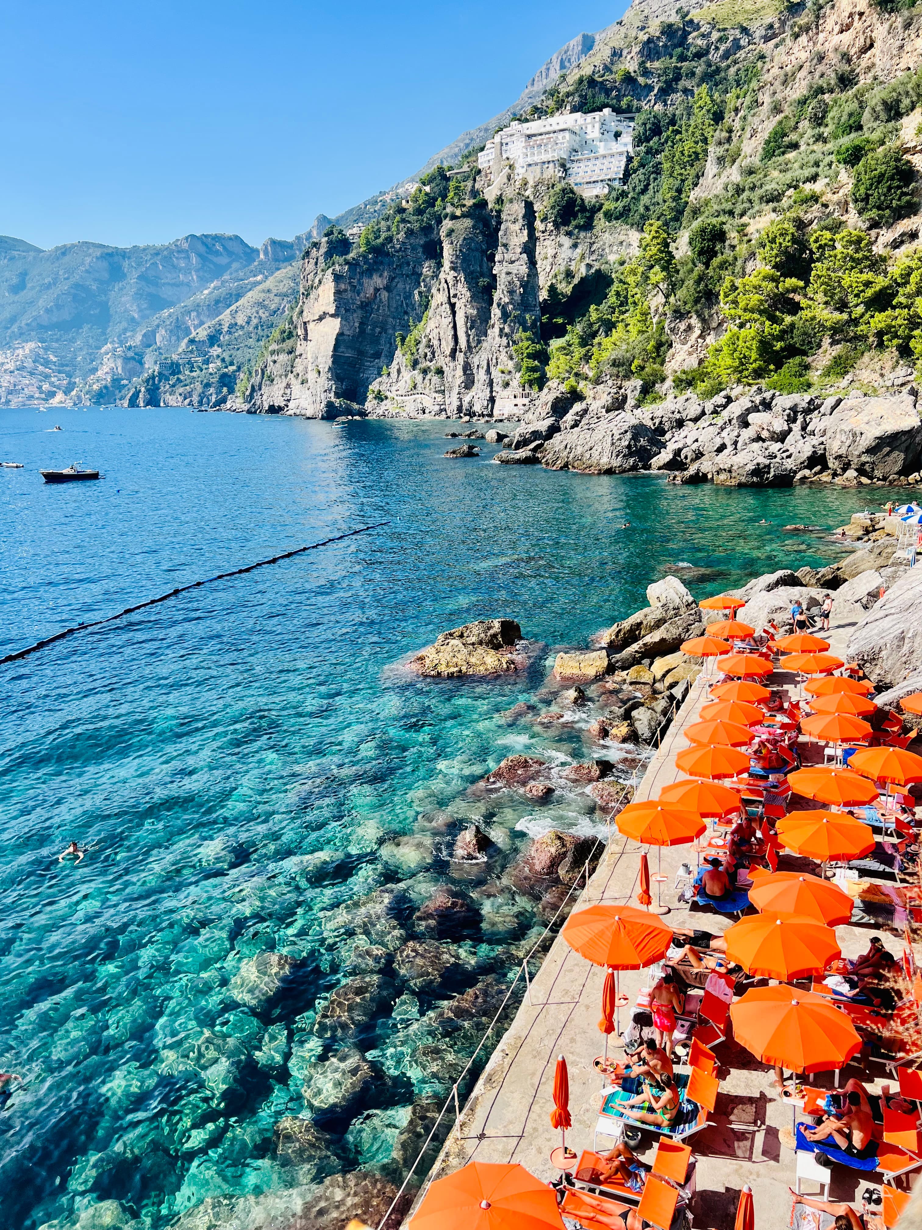 Orange umbrellas set up on the beach