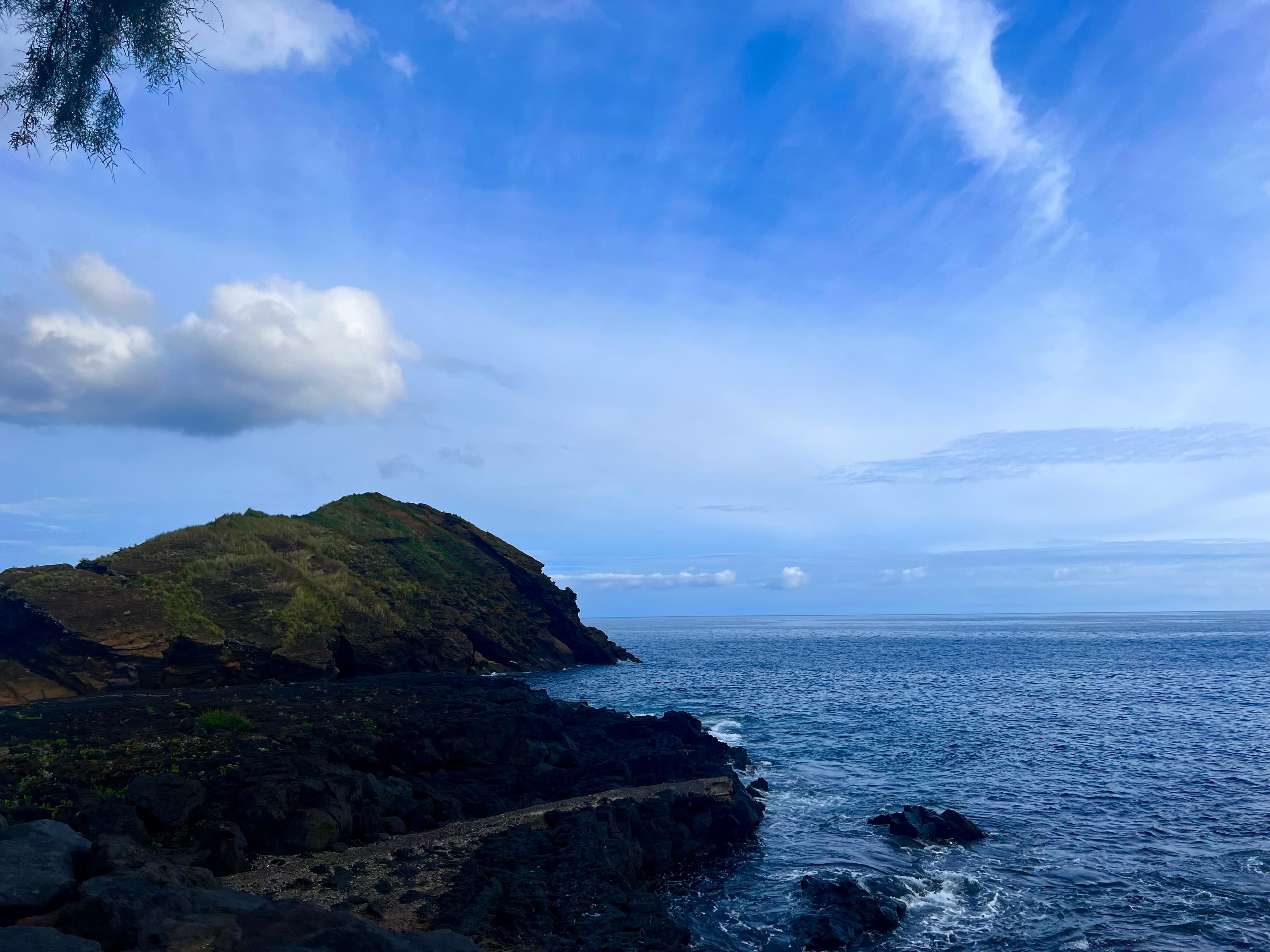 A view of the sea with a mountain to the left