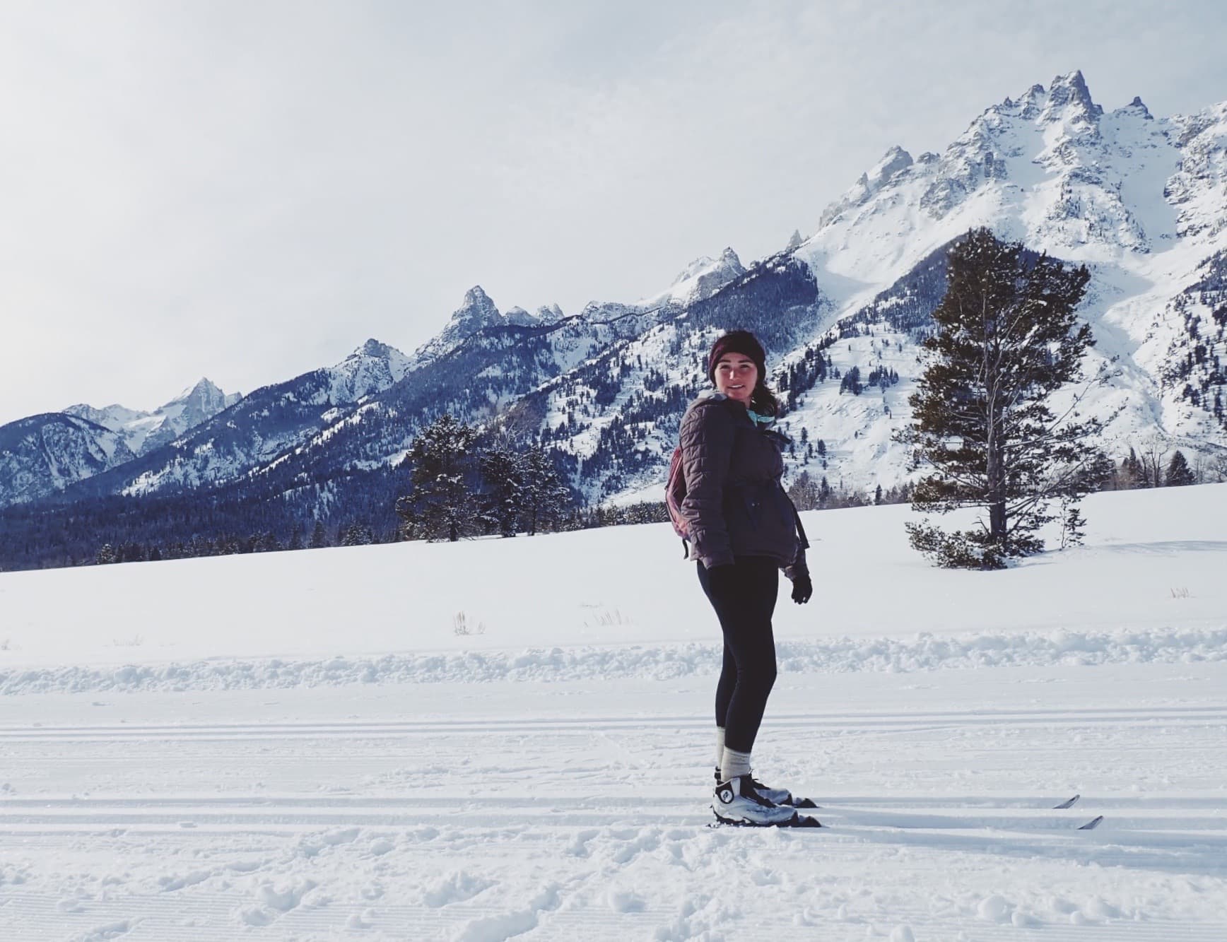 Travel advisor posing in a snowy region