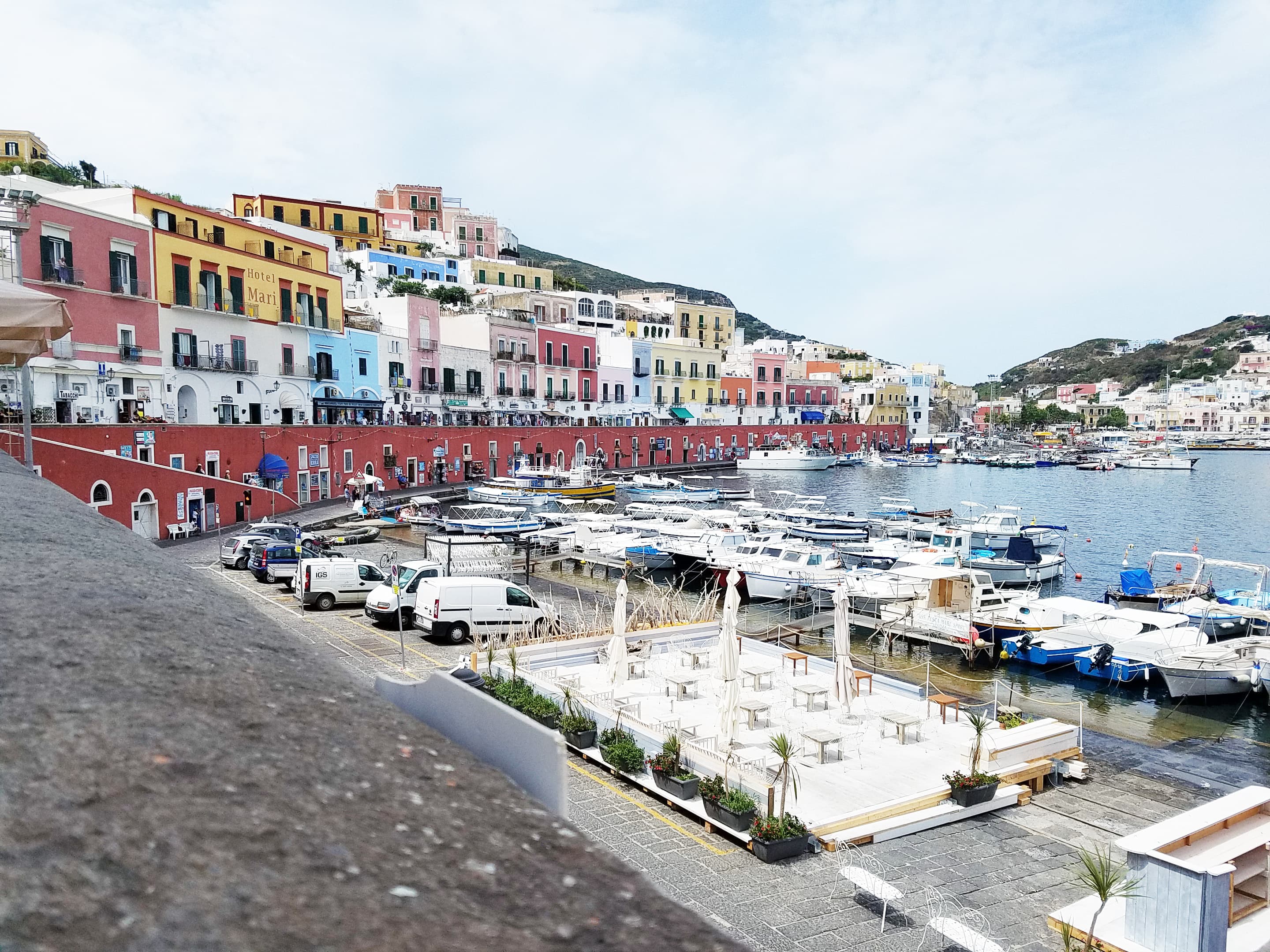 Coastal city Ponza with boats.