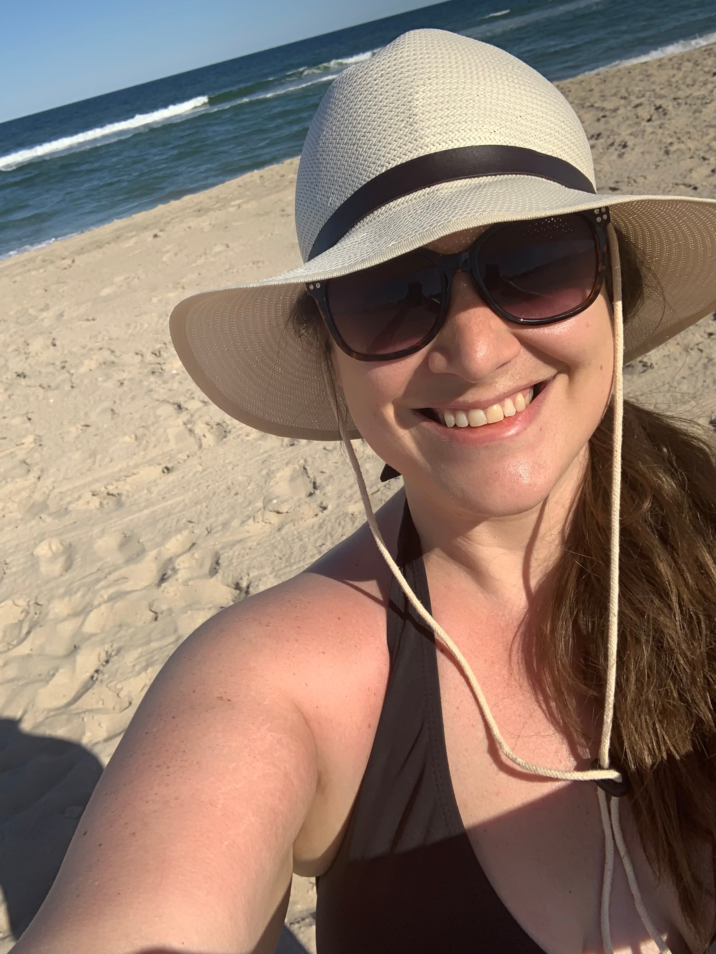 selfie on beach in hat