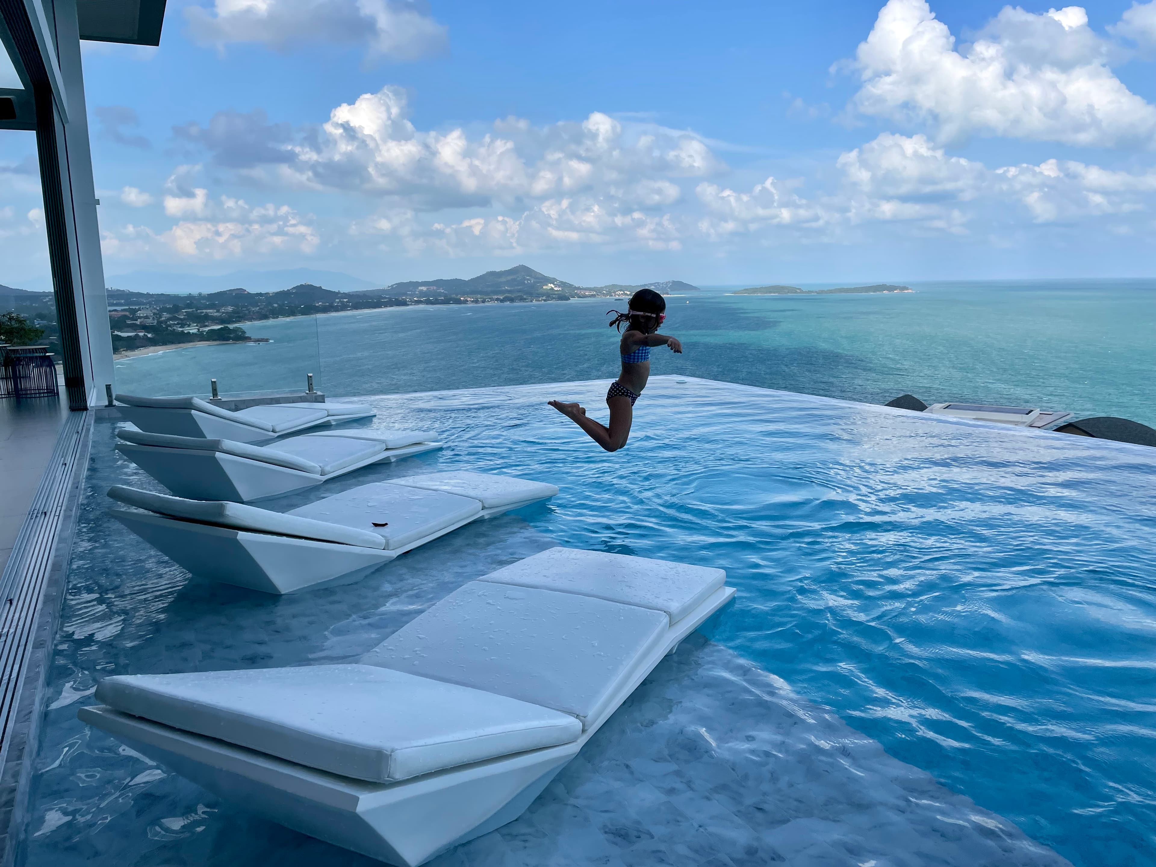 kid jumping in pool