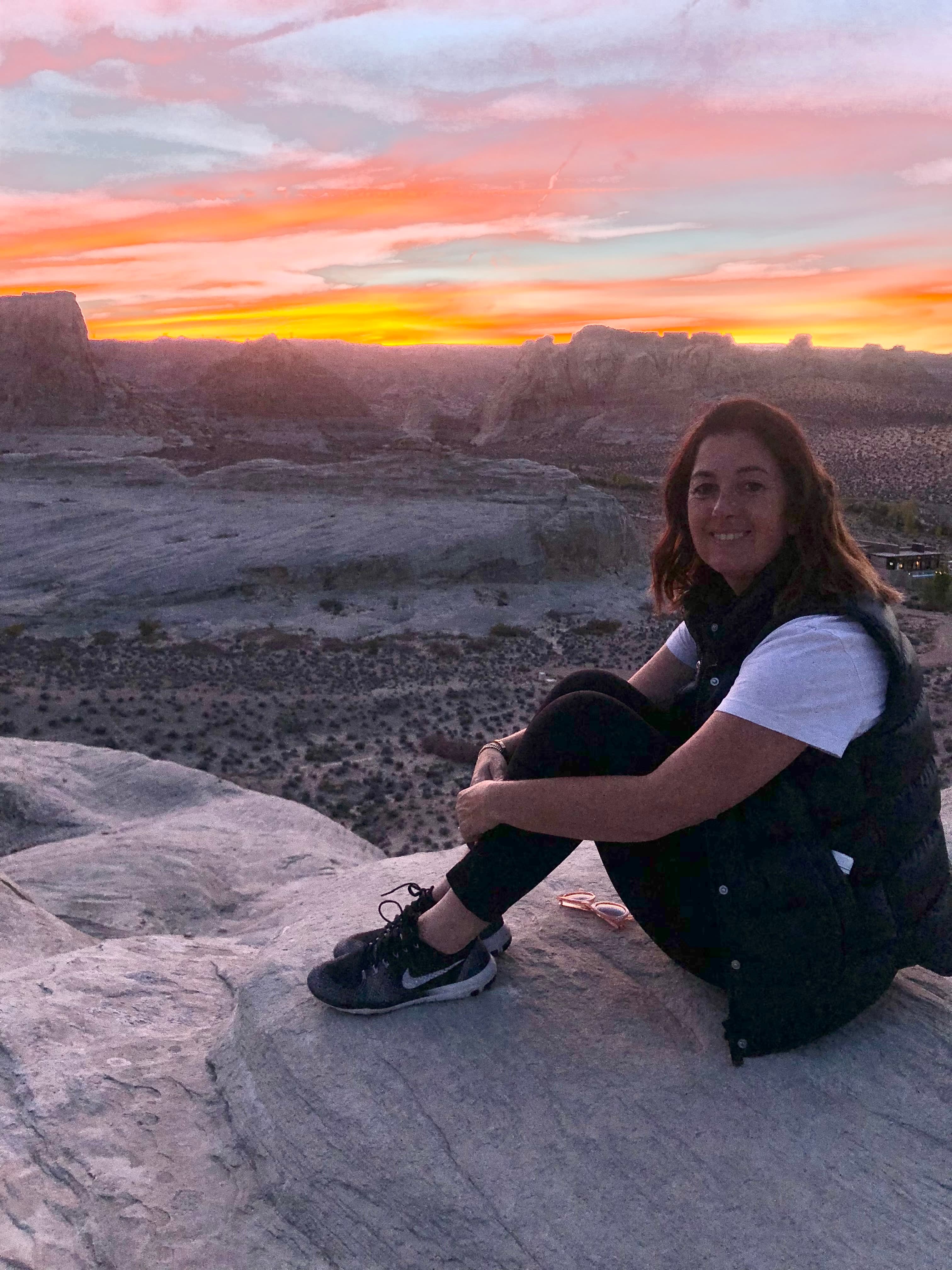 Travel advisor posing on rock