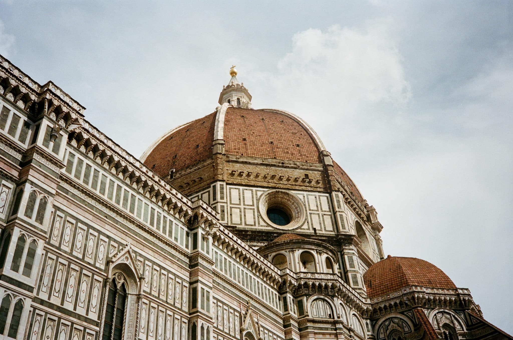 Low-angled view of an ornate building with a dome-shaped tower