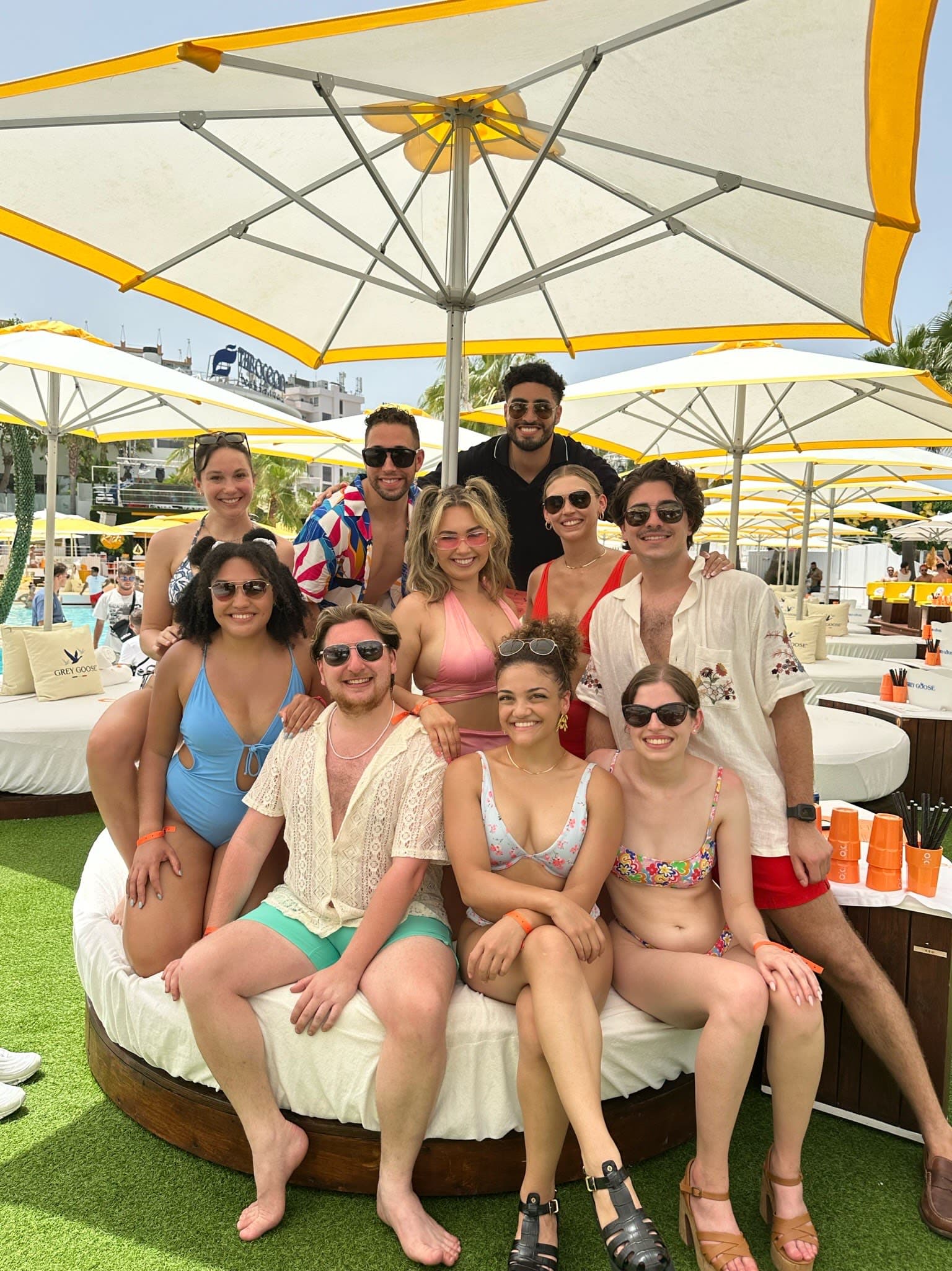 Posing for a group photo under the umbrella