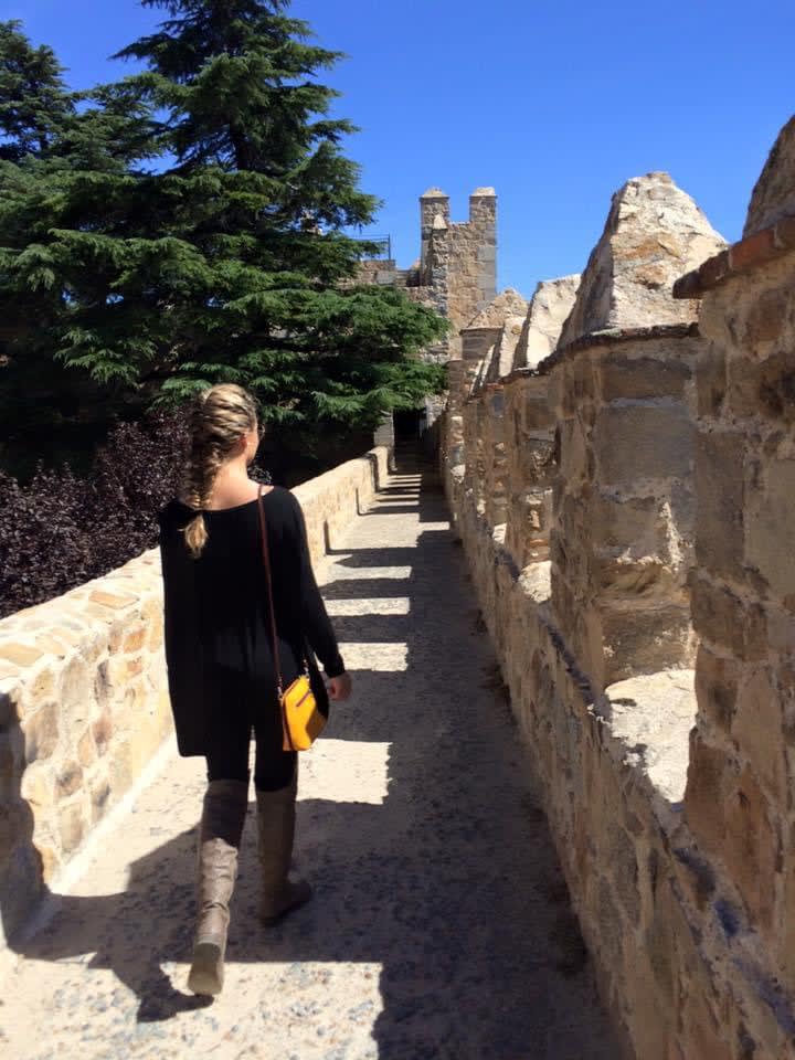Walking on a narrow path leading to a castle