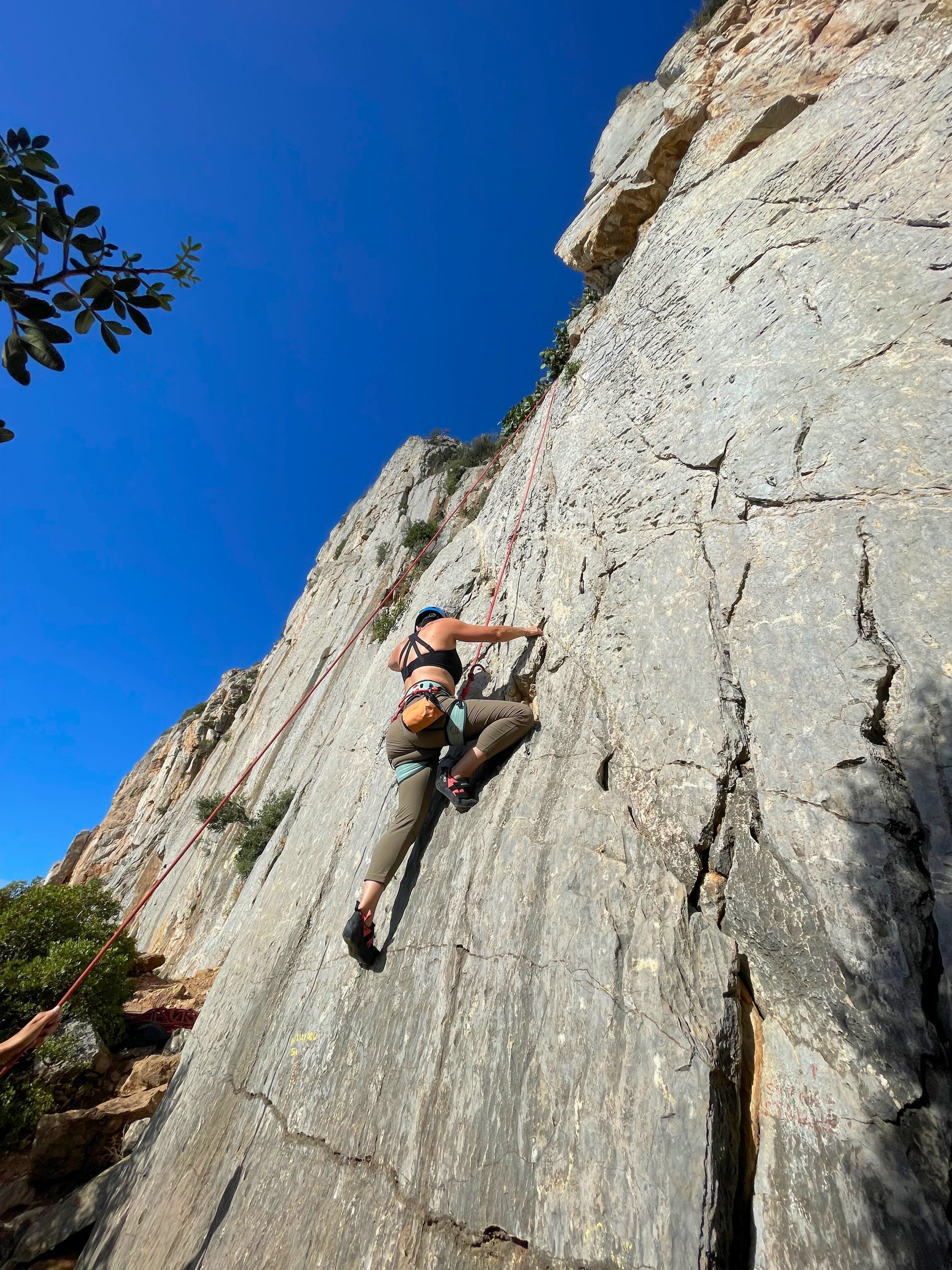 Rock climbing on the side of a hill