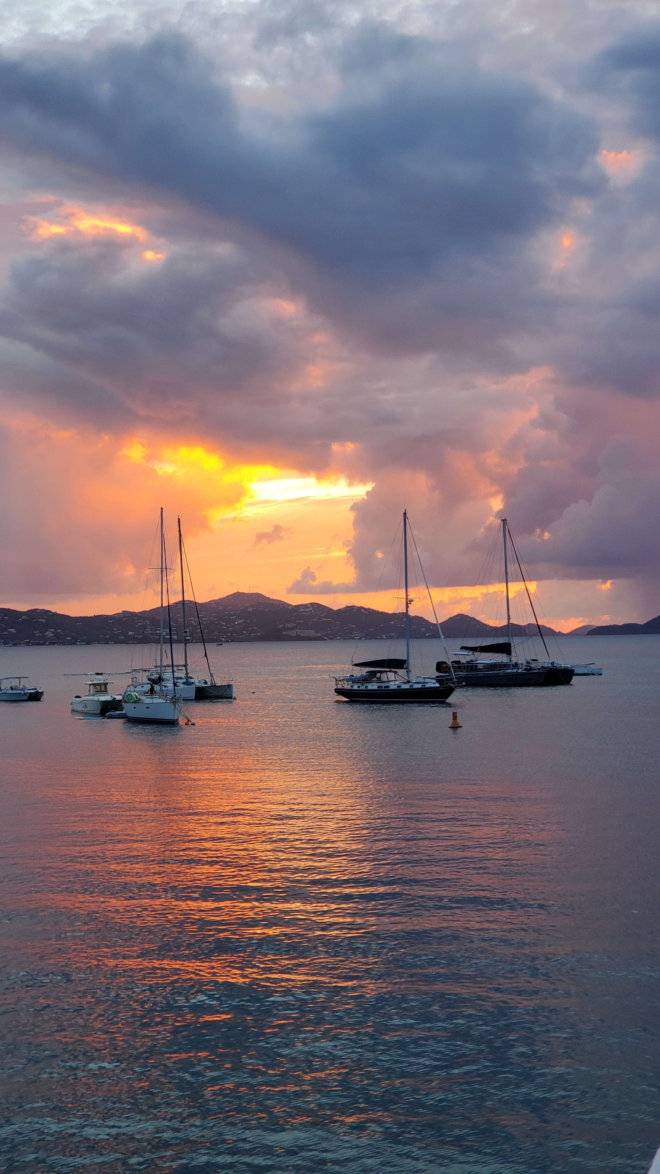 Beautiful view of boats in a the sea at sunset