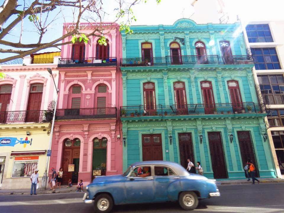 Old car and colorful buildings in Cuba