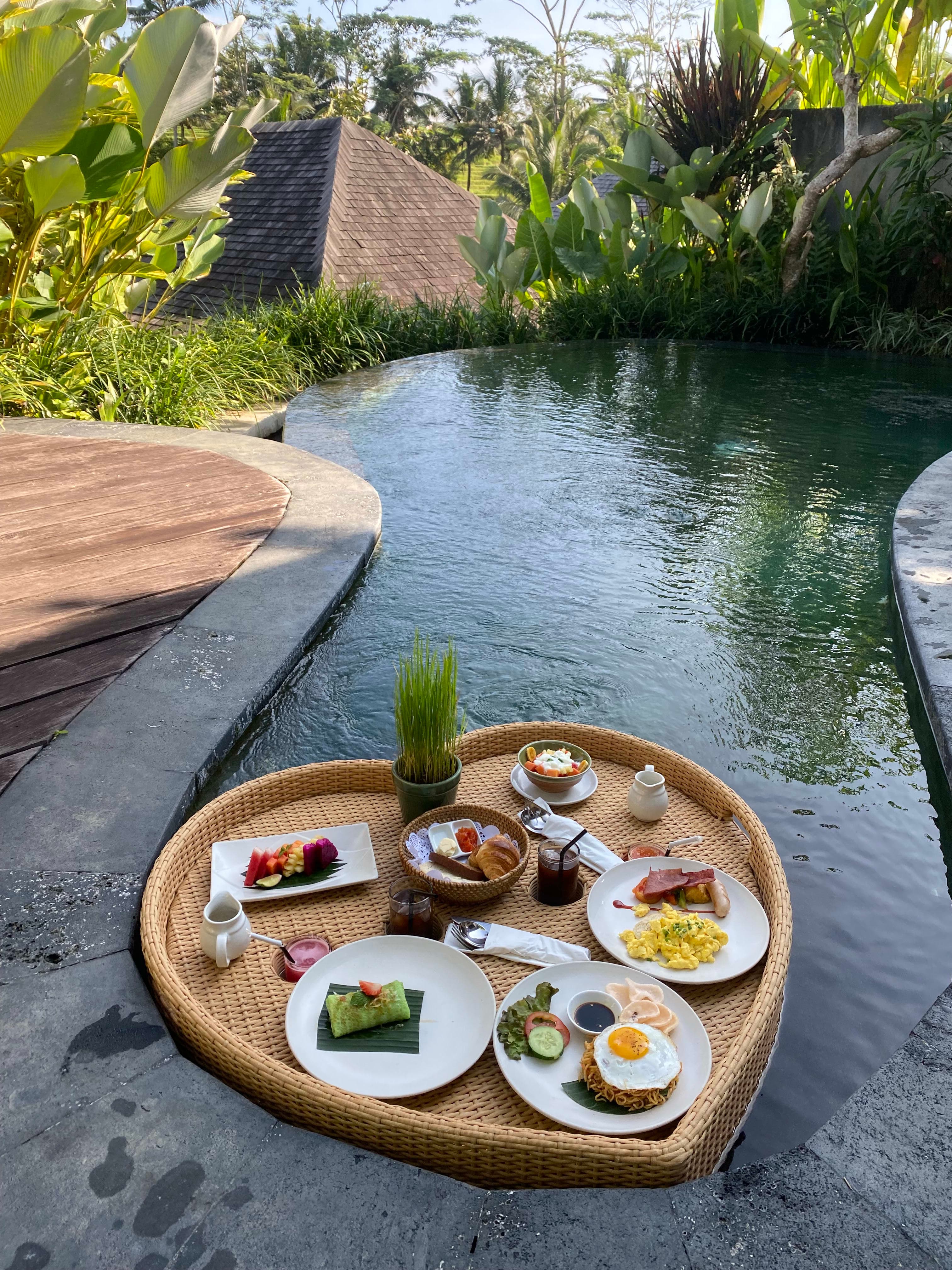 Picture of heart shaped floating breakfast on a river