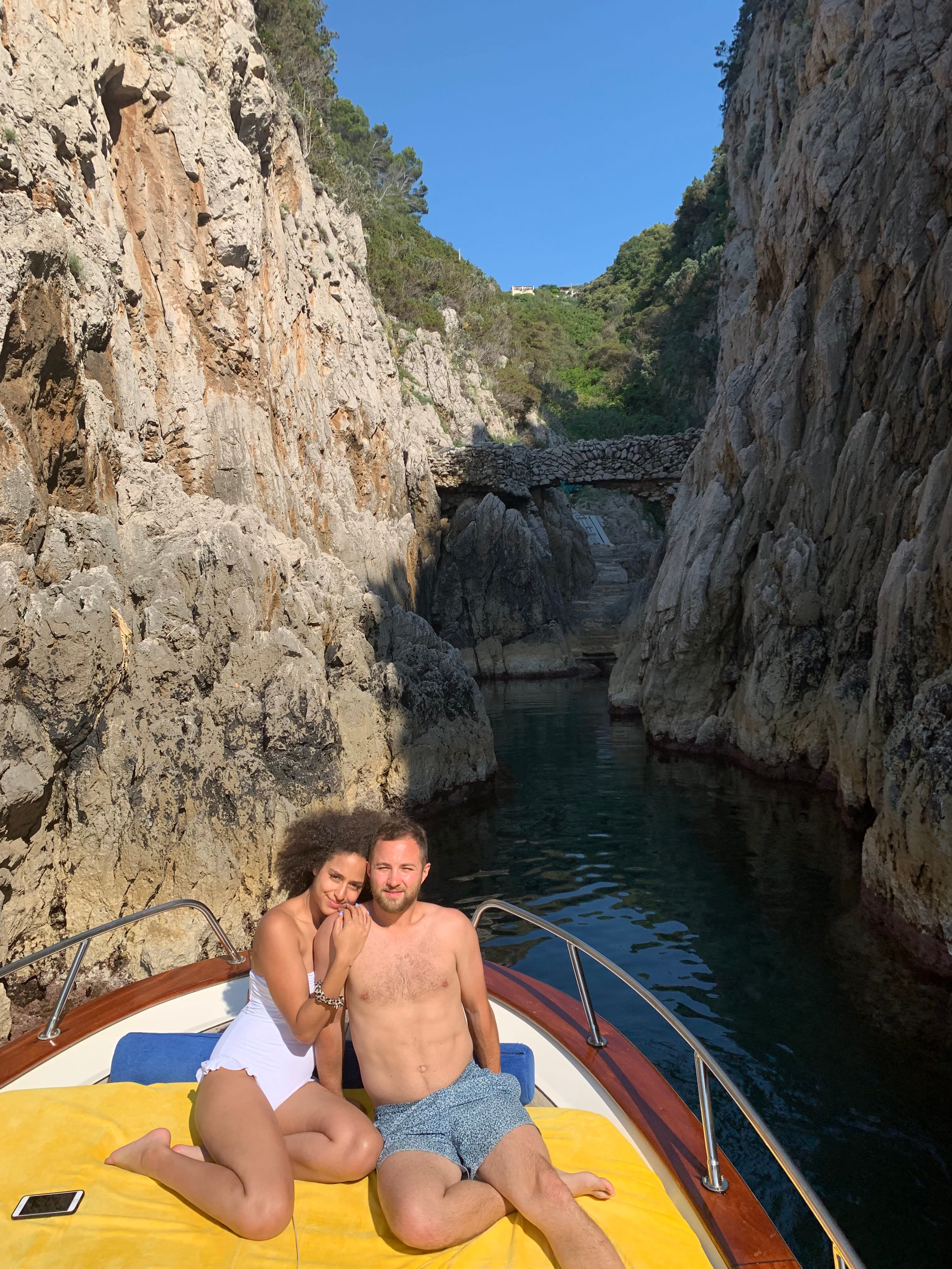 Picture of Danielle with a man on a yellow boat in a canyon