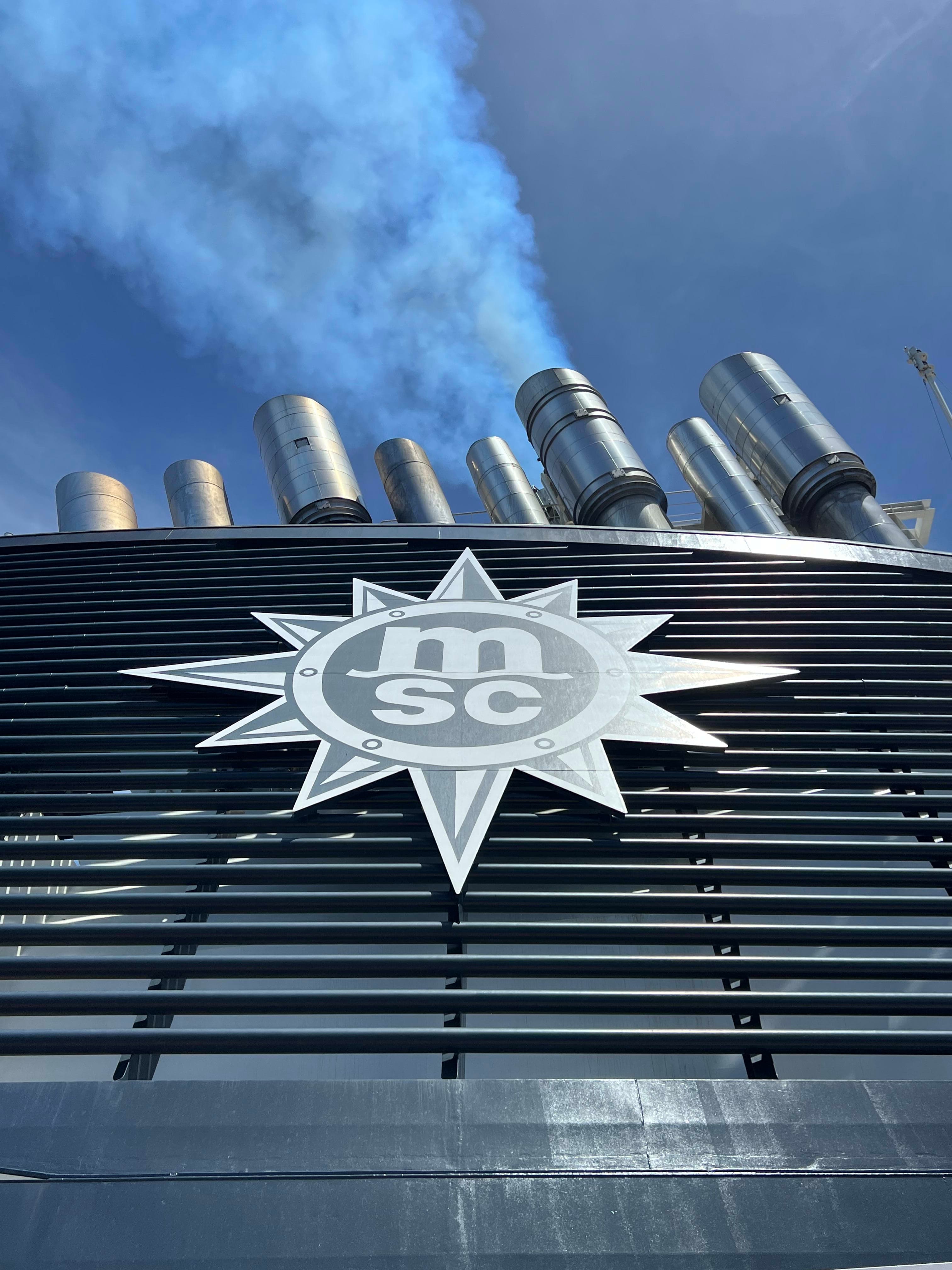 View of a silver star logo on a building with the letters MSC