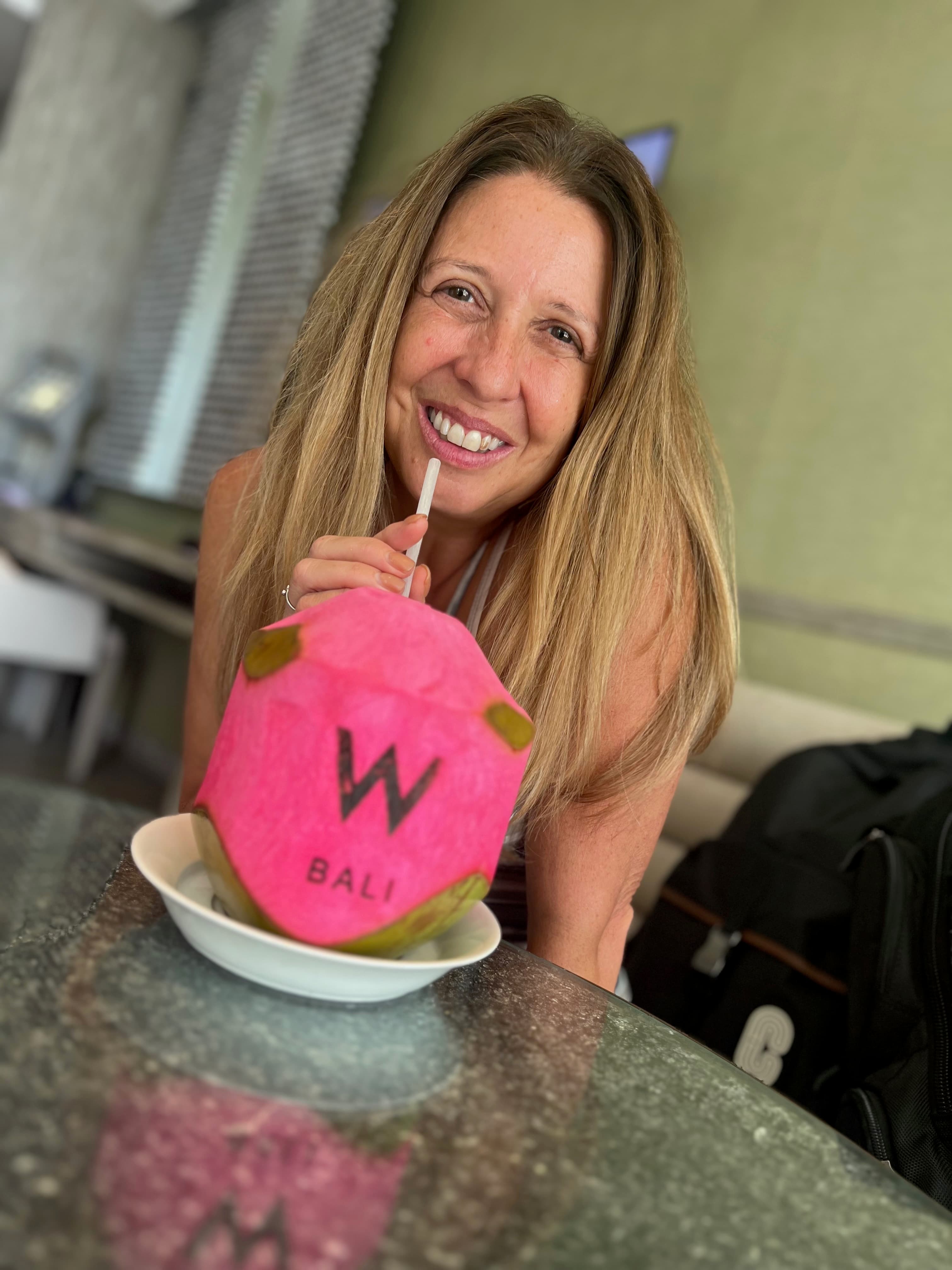 Enjoying a fruit drink.