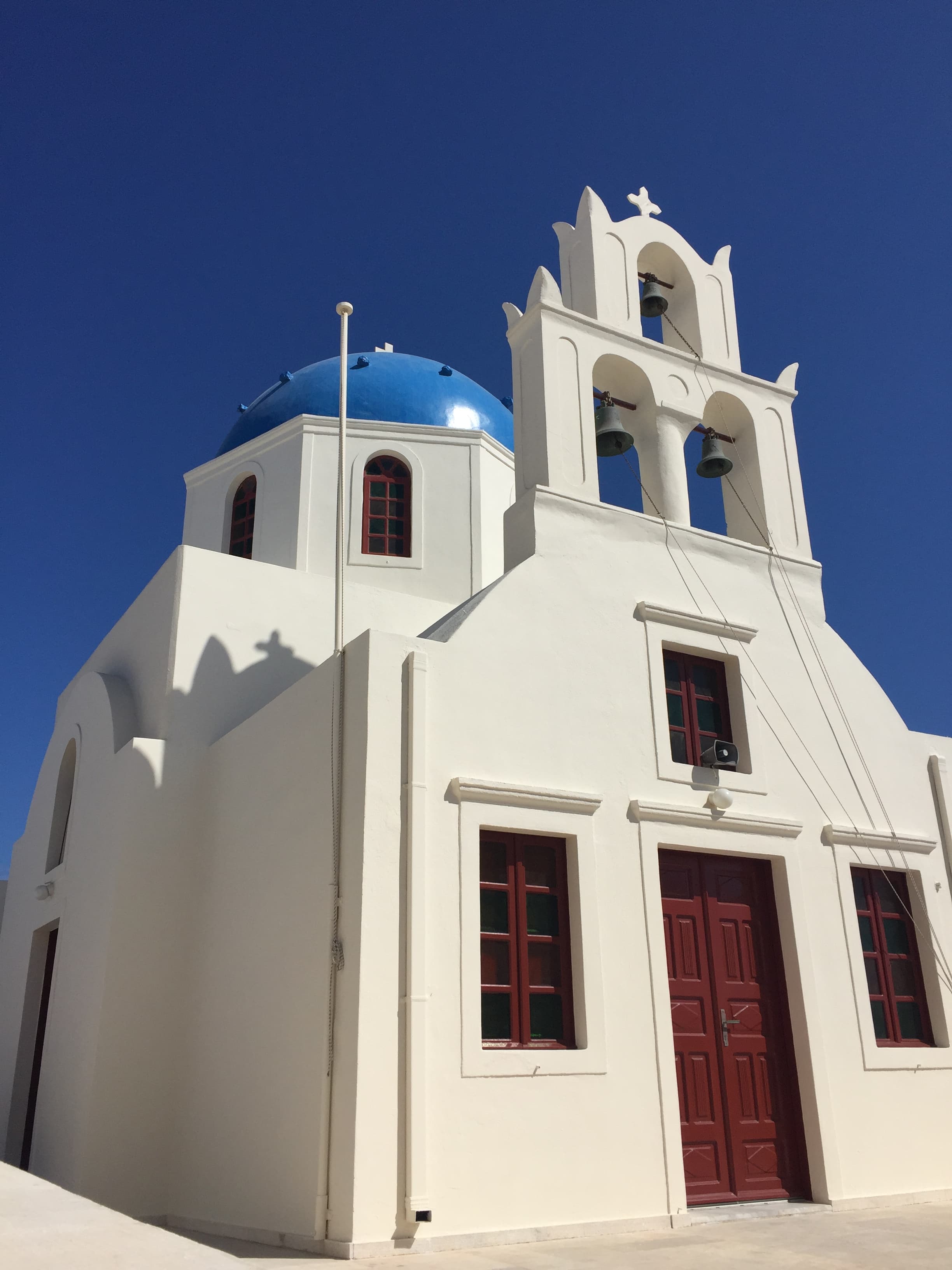View of a white building with blue dome on a clear day