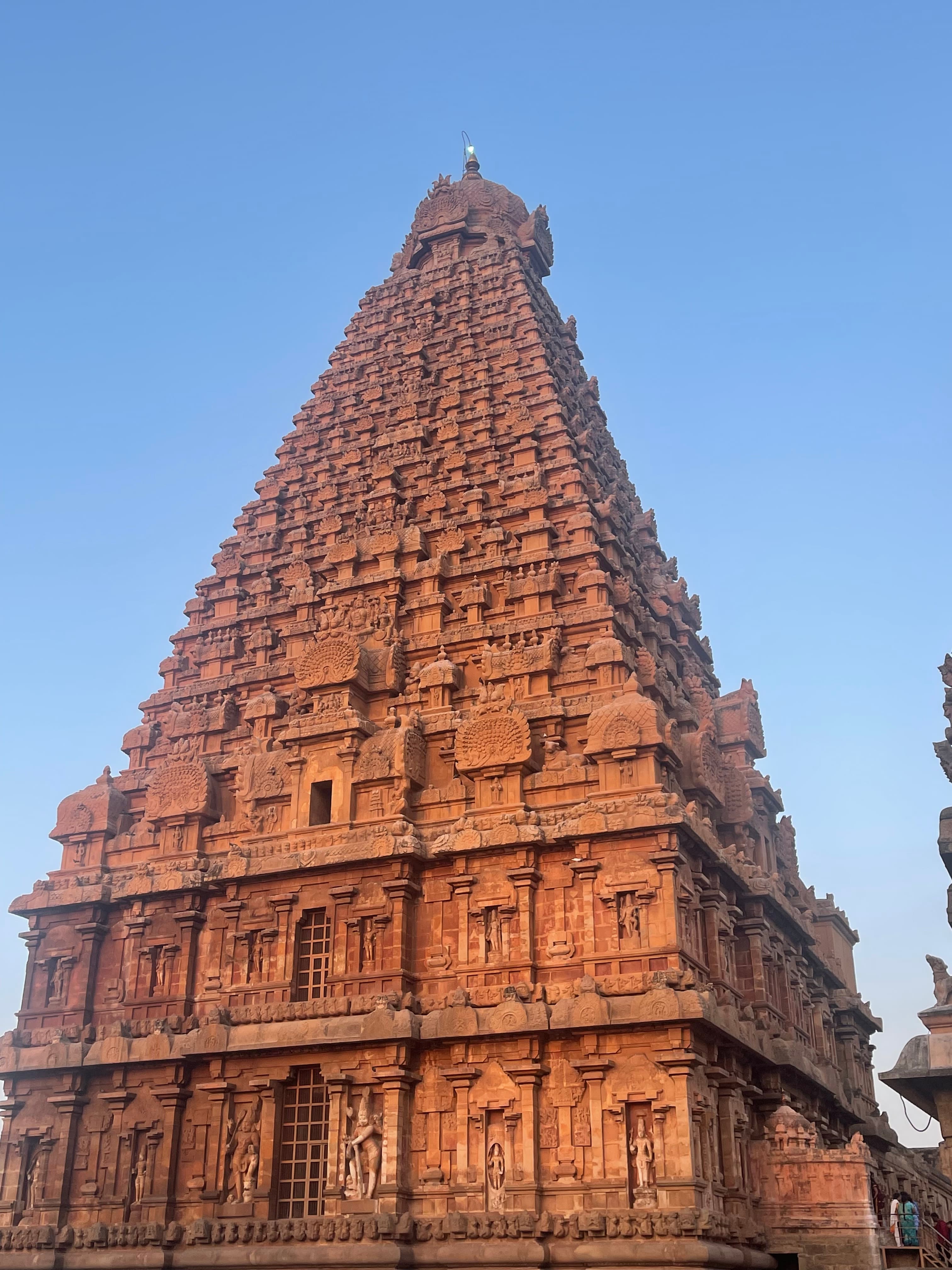 A large historical building shaped like a pyramid with ornate carvings on all sides.