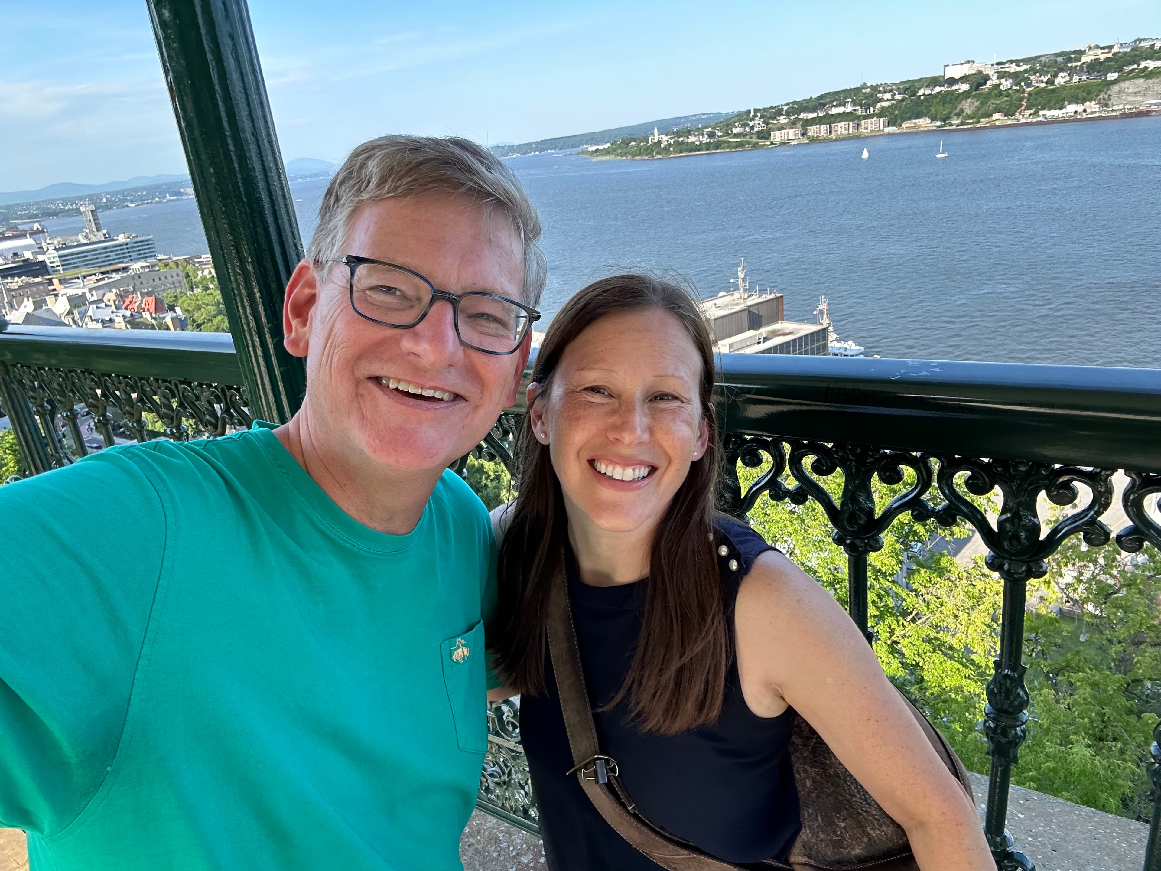Couple posing on a balcony.