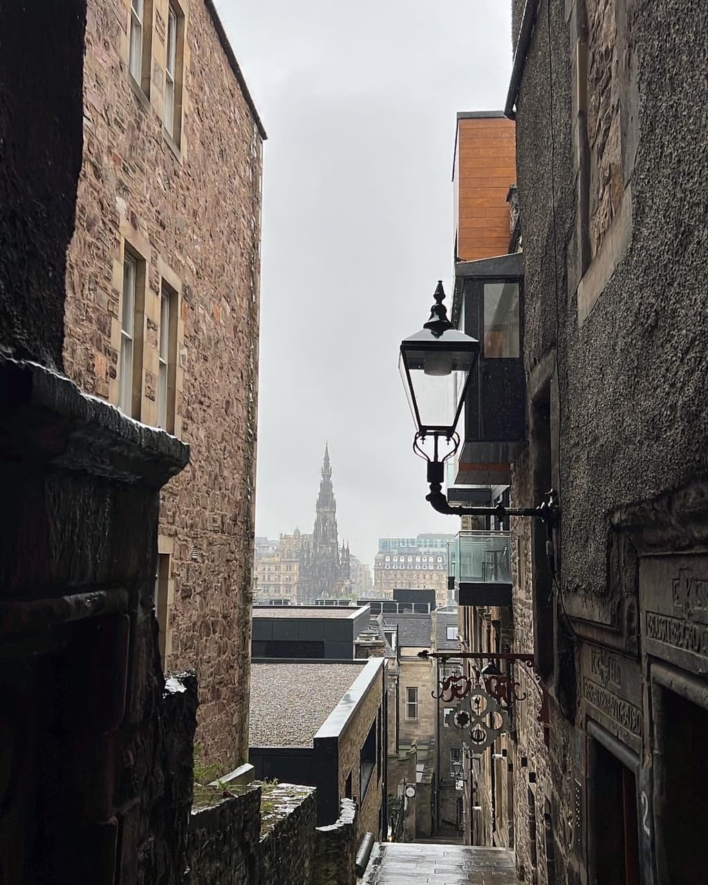 View of a foggy cityscape seen between two buildings