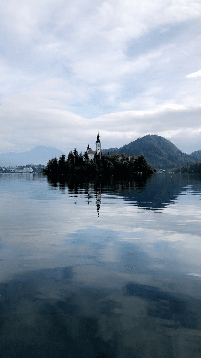 Castle and hills overlooking the water.