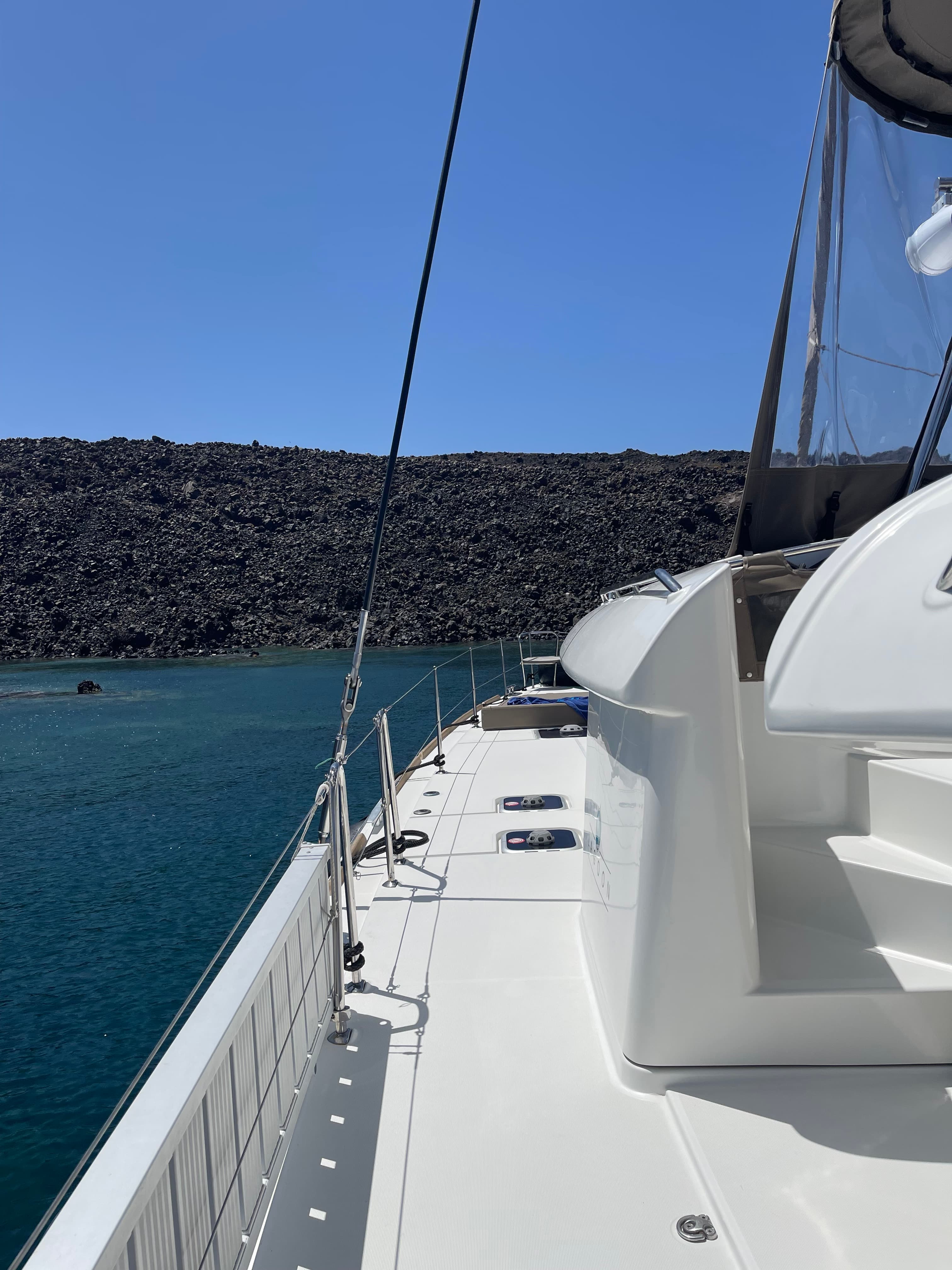View of a white boat on the ocean during the daytime.
