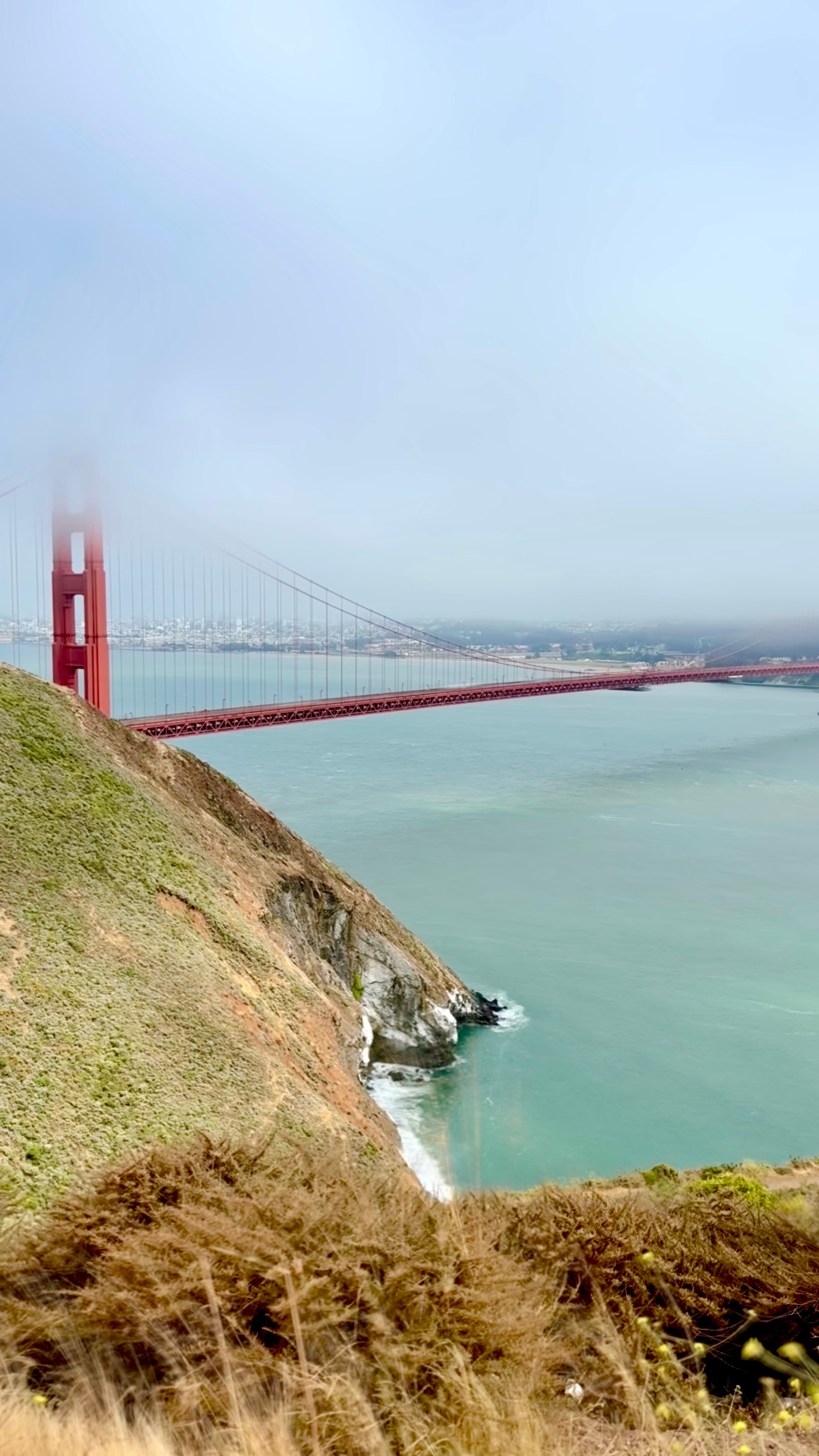 View of the Golden Gate Bridge hidden in fog