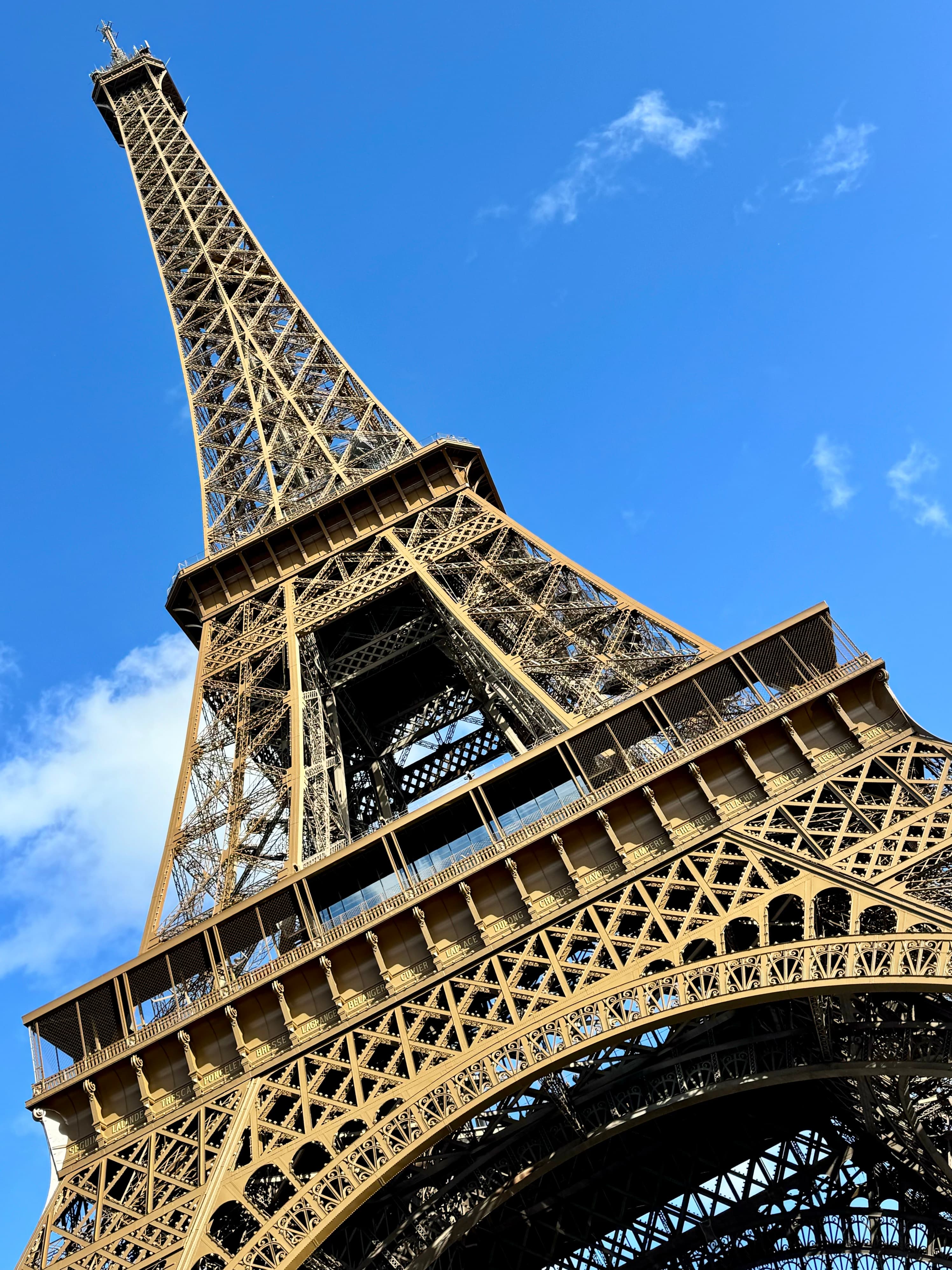 Upwards facing view of the Eiffel Tower on a sunny day