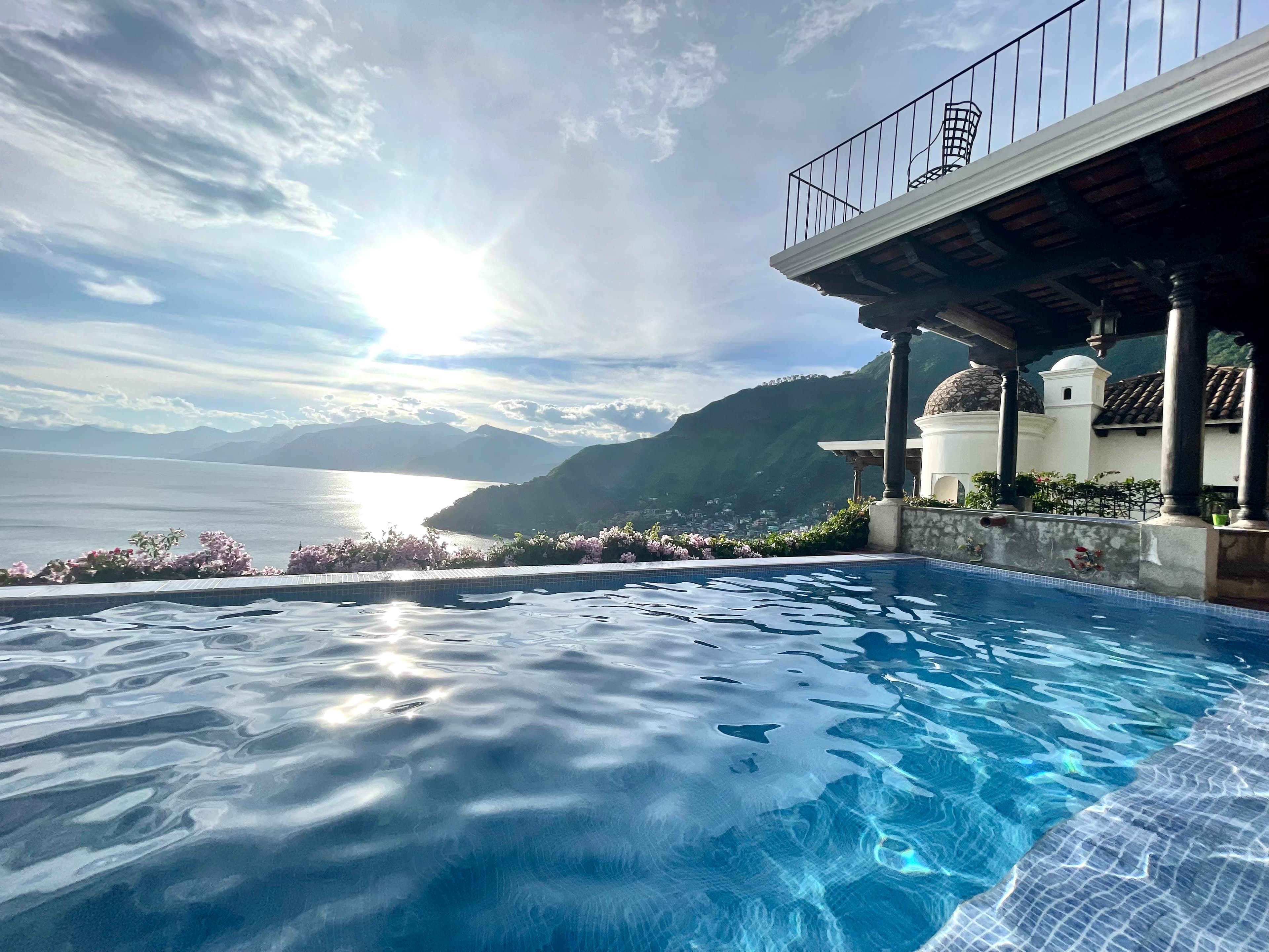 View of a beautiful infinity pool overlooking the sea on a sunny day