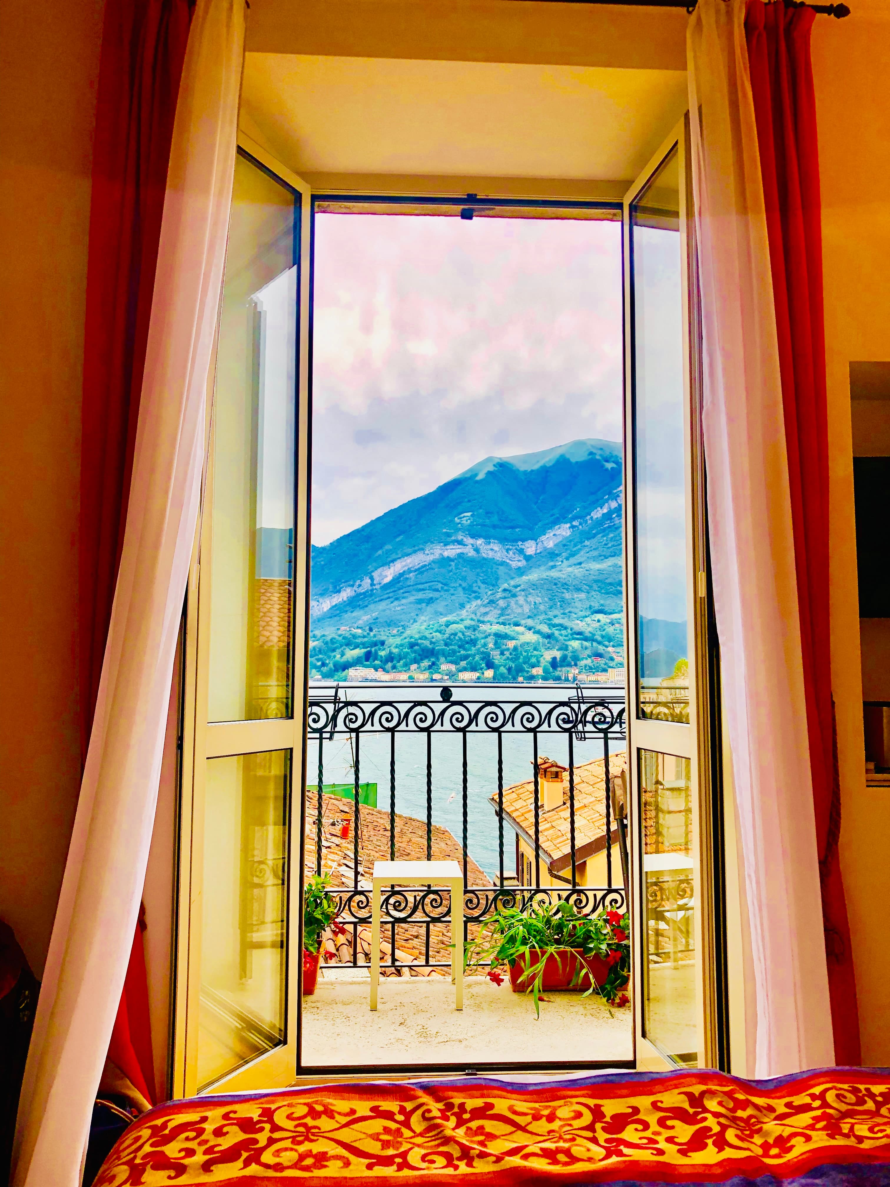A view of a lake with a mountain range in the distance.