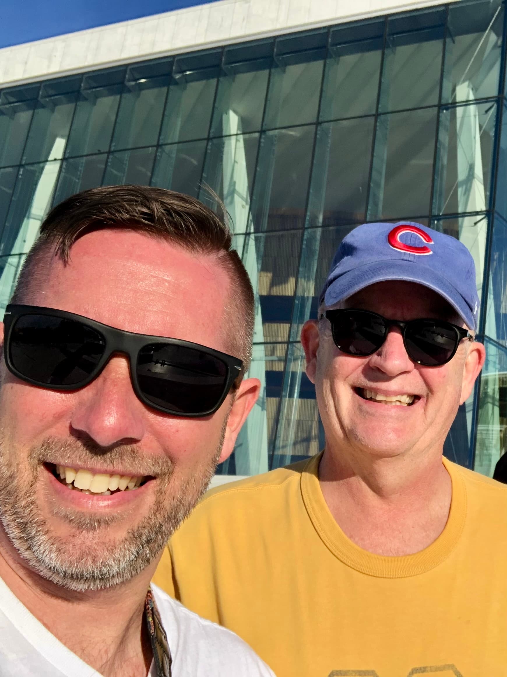 Advisor posing with a friend during the daytime.