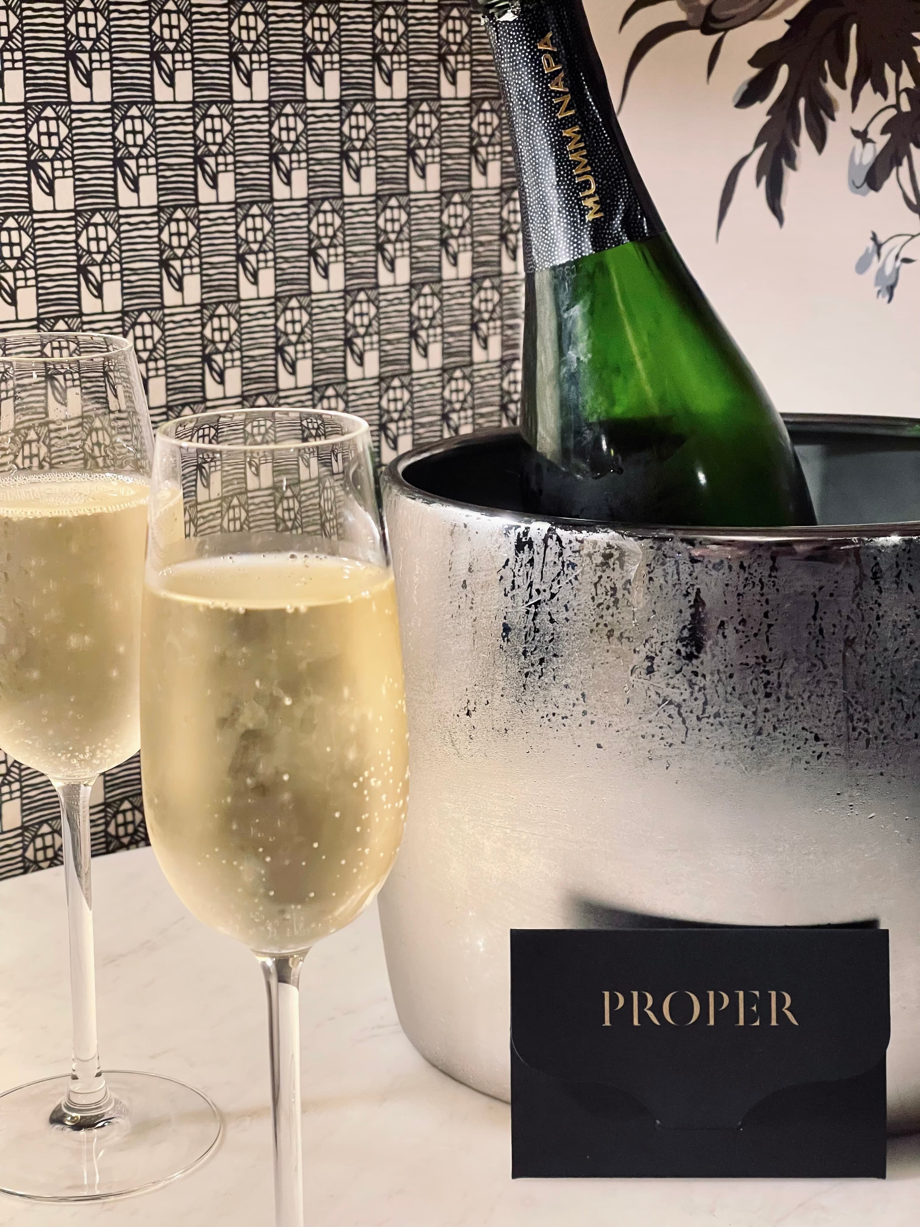 Classic champagne glasses and an ice bucket.