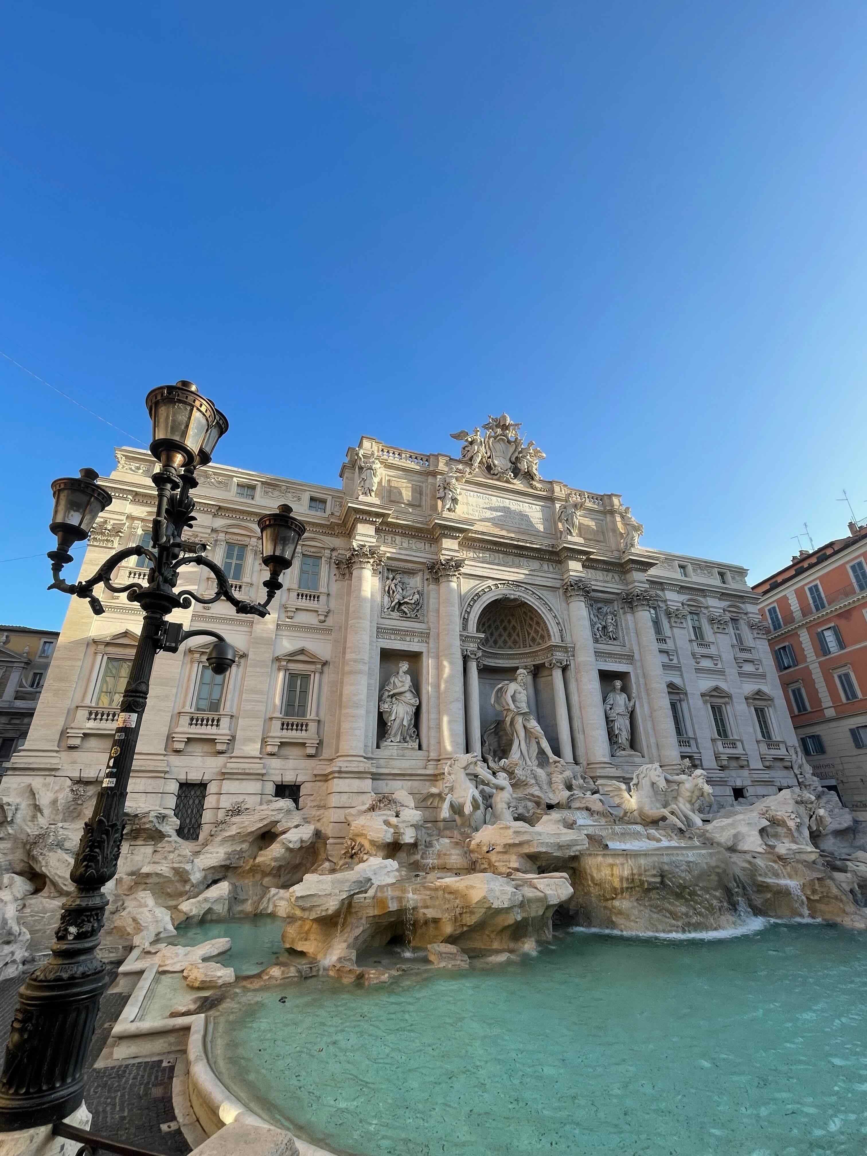 View of the Trevi Fountain in Rome on a sunny day