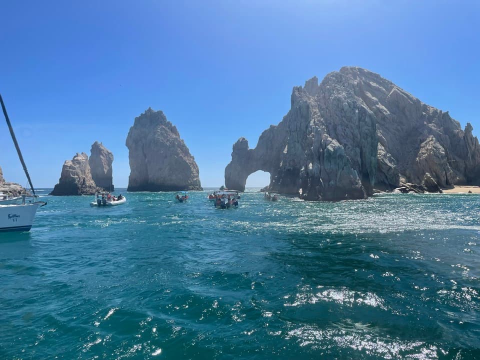 A view of stone arches and the ocean in Cabo san Lucas, Mexico.