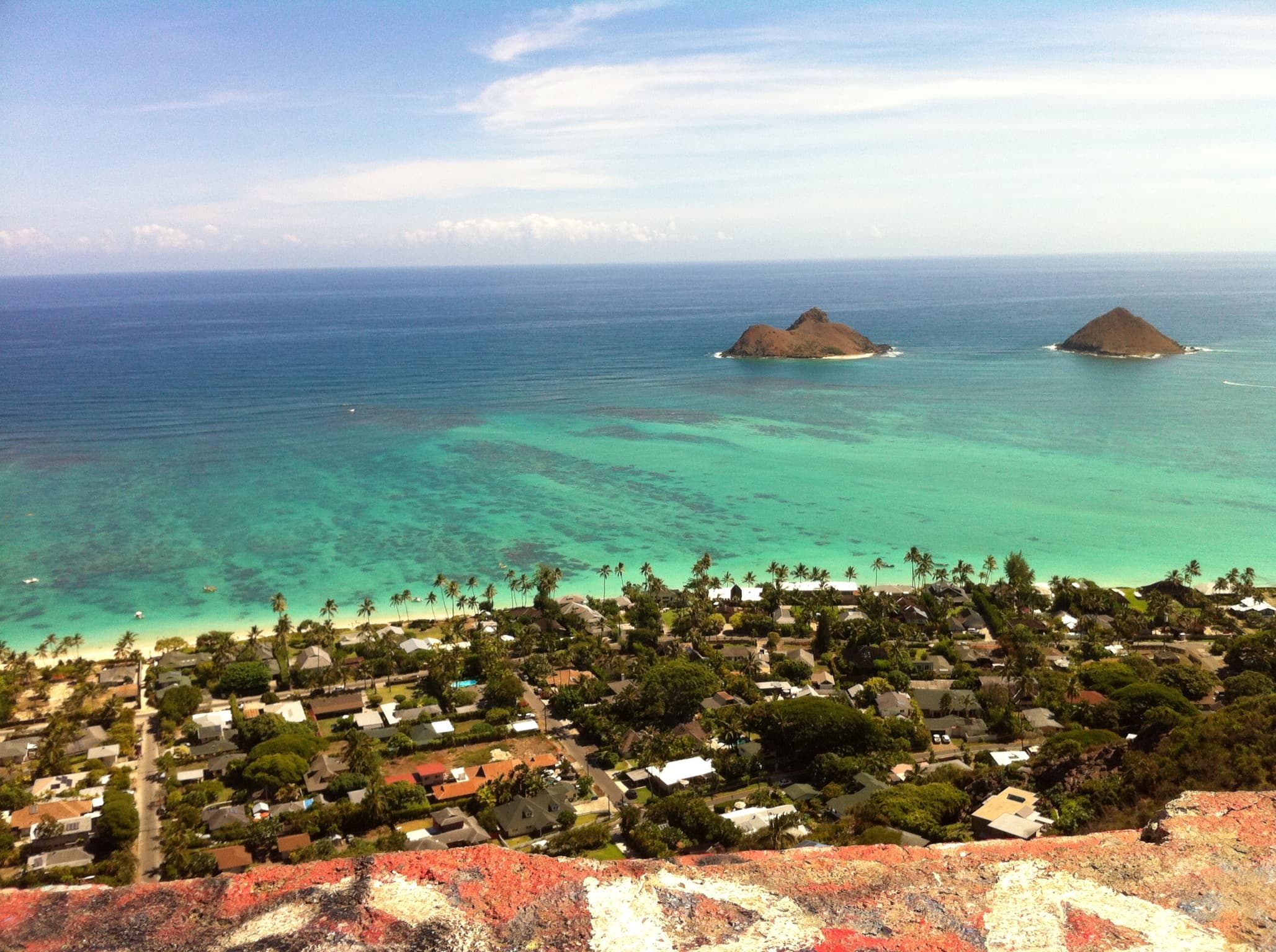 Aerial view of a beach and seaside resort on a sunny day