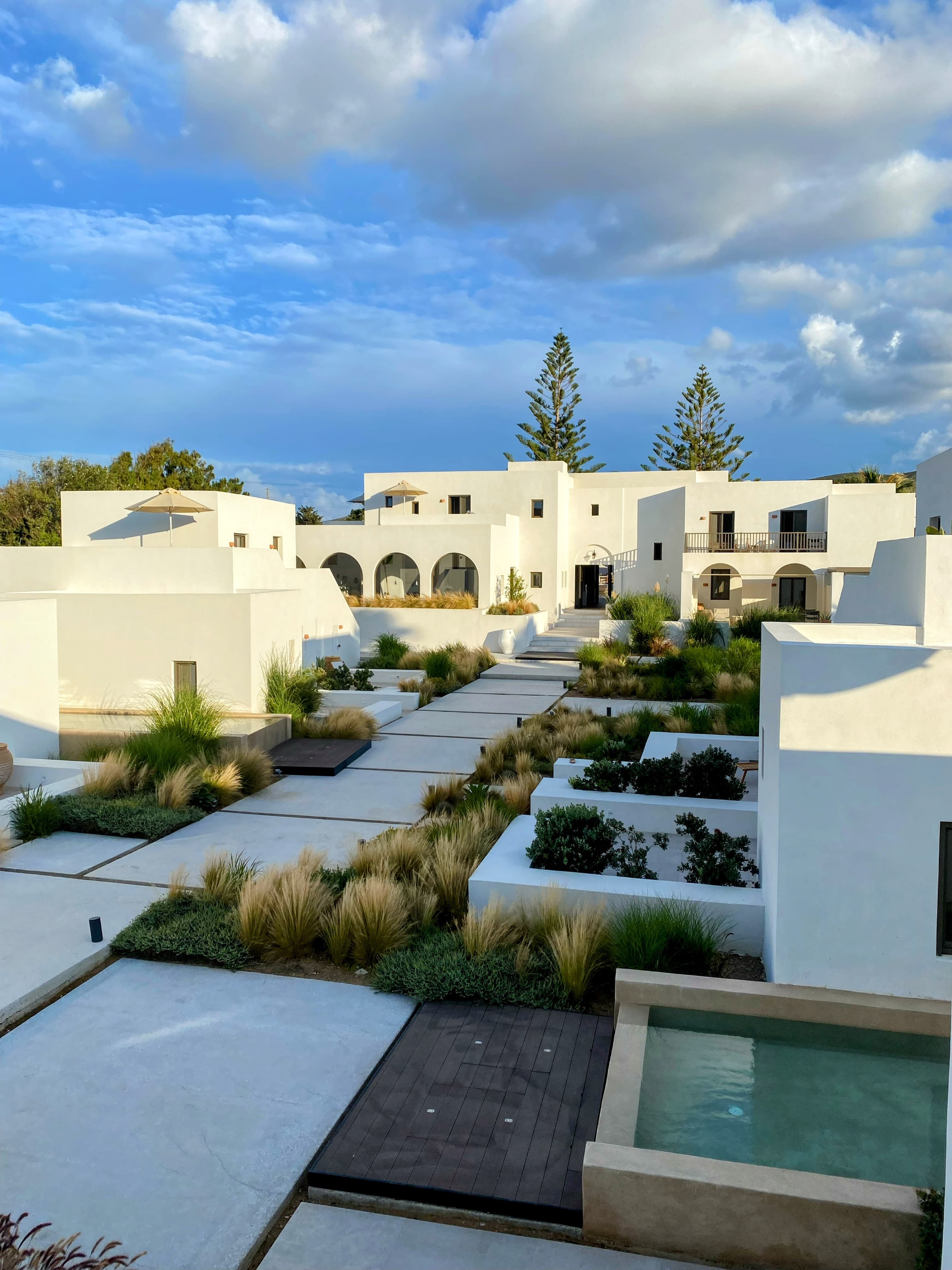 View of a white modern hotel building on a sunny day