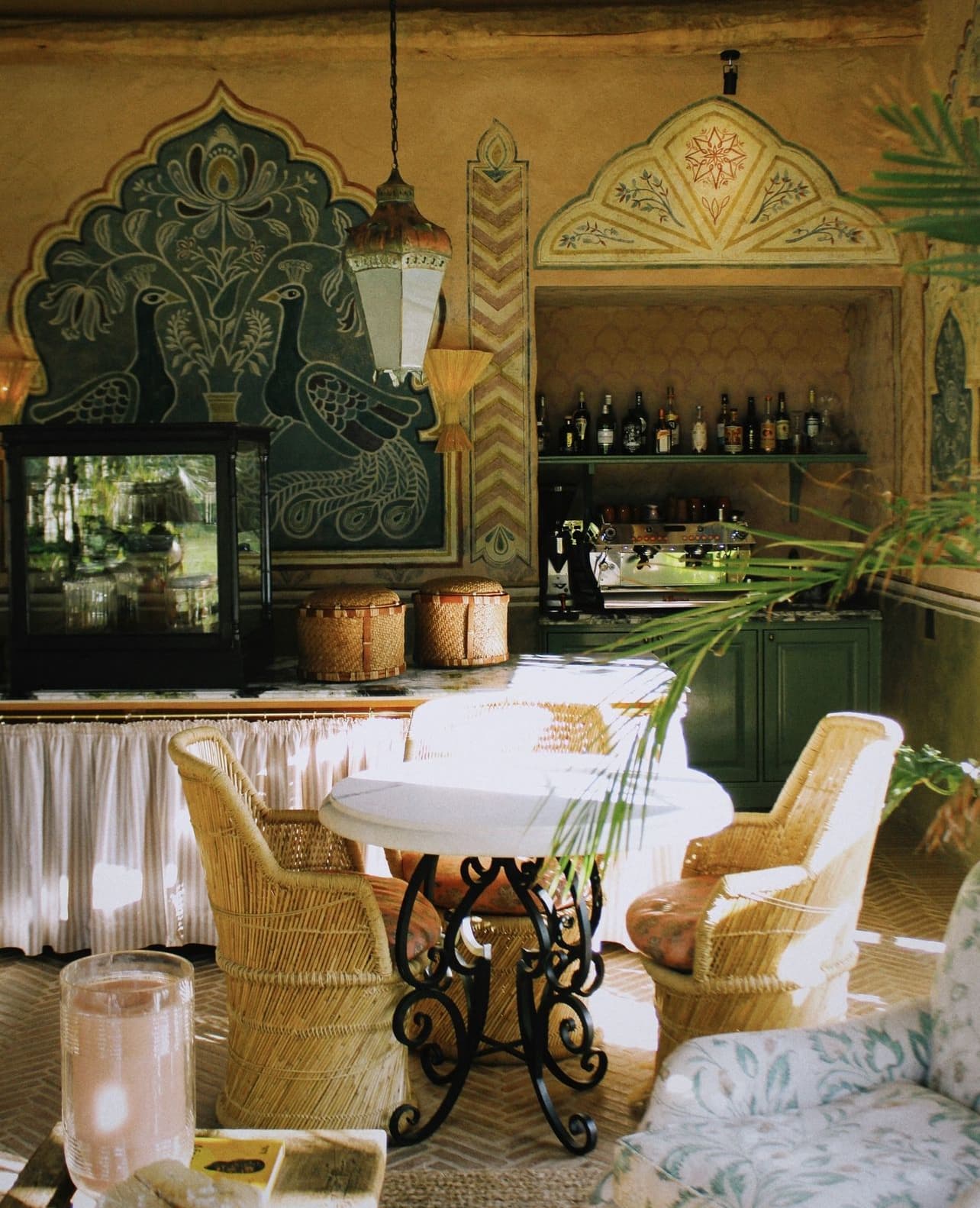Interior view of a hotel dining area with two chairs around a small circular table