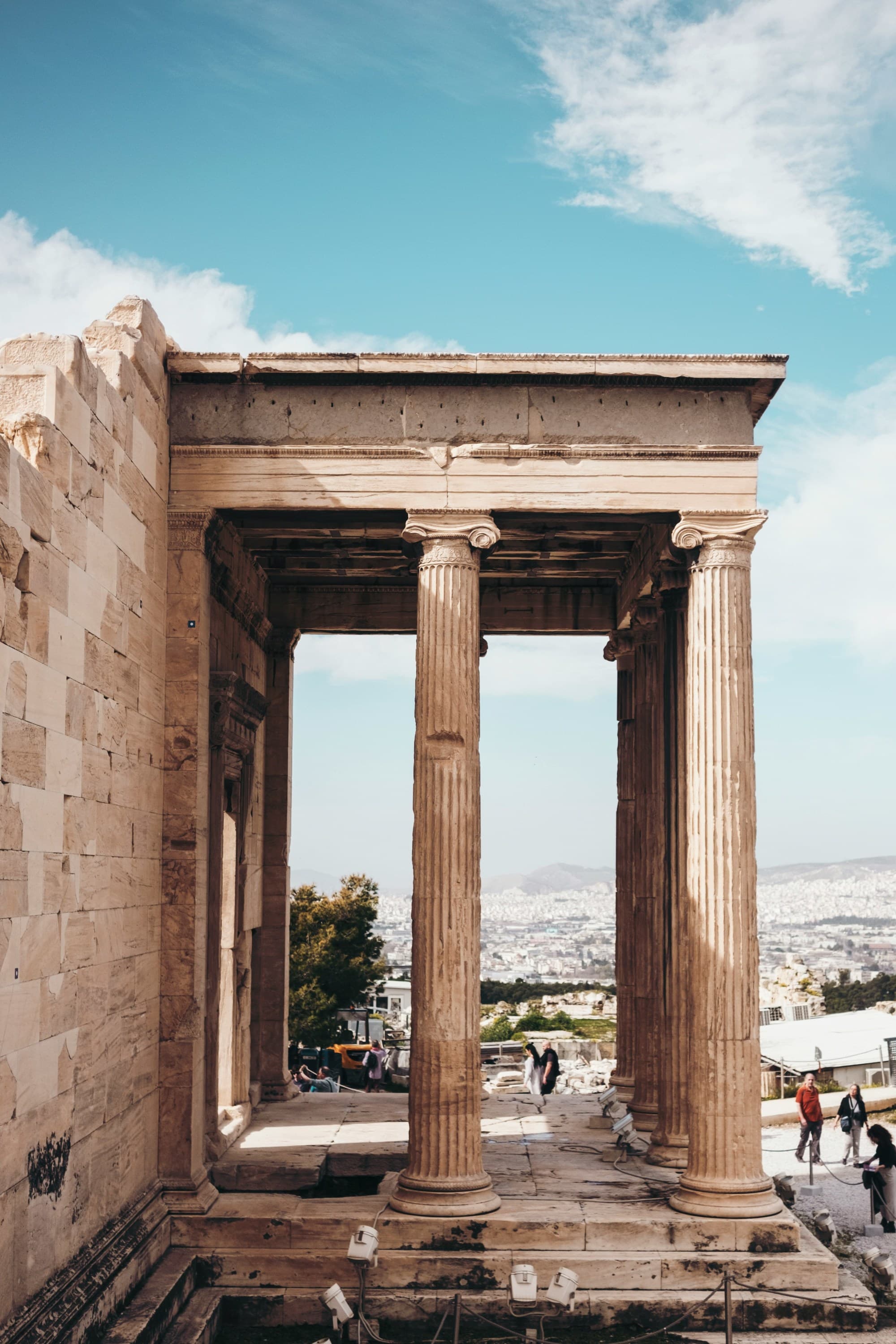 Ruins of an old building with pillars on a sunny day.