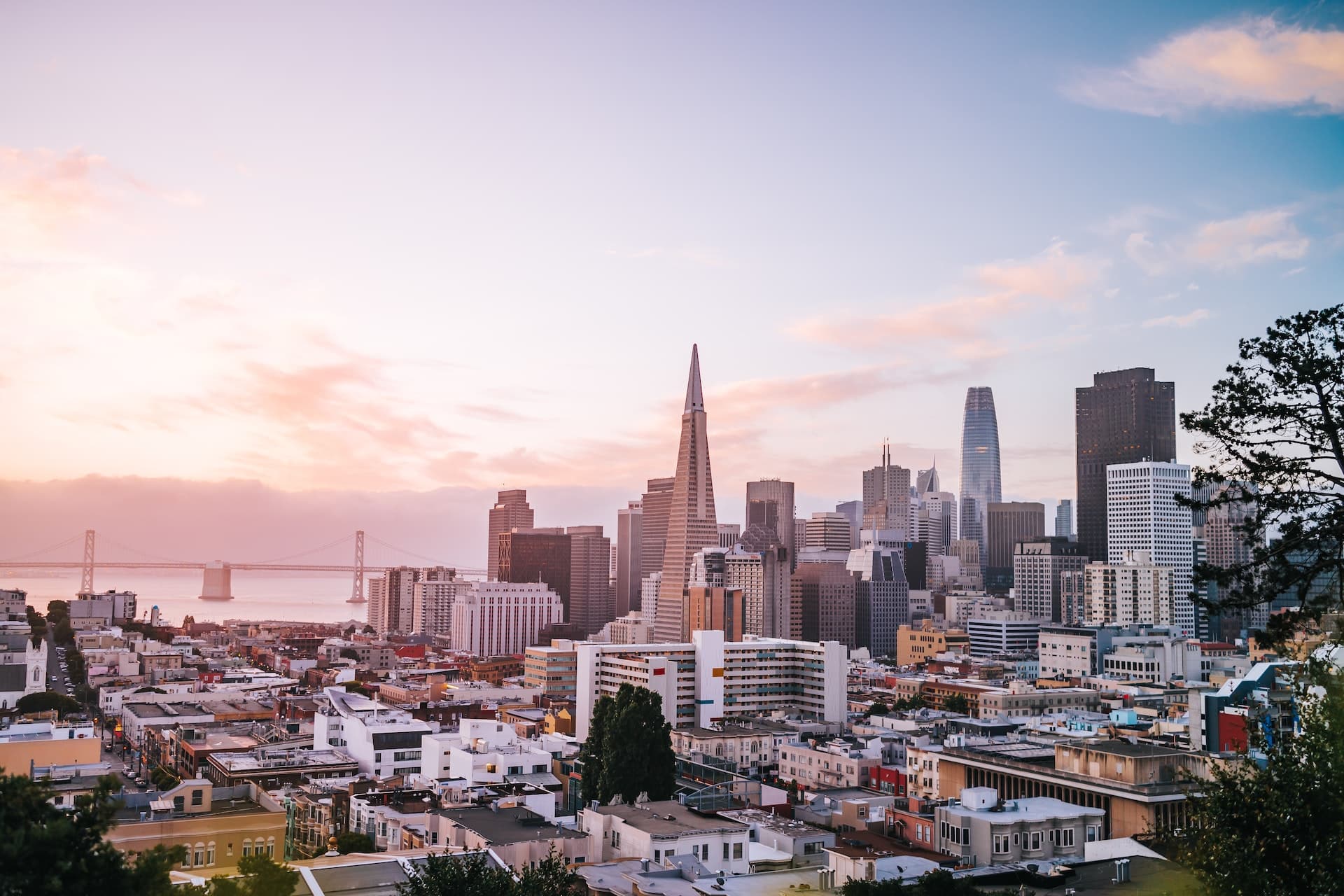 City skyline with buildings and sea in the background.