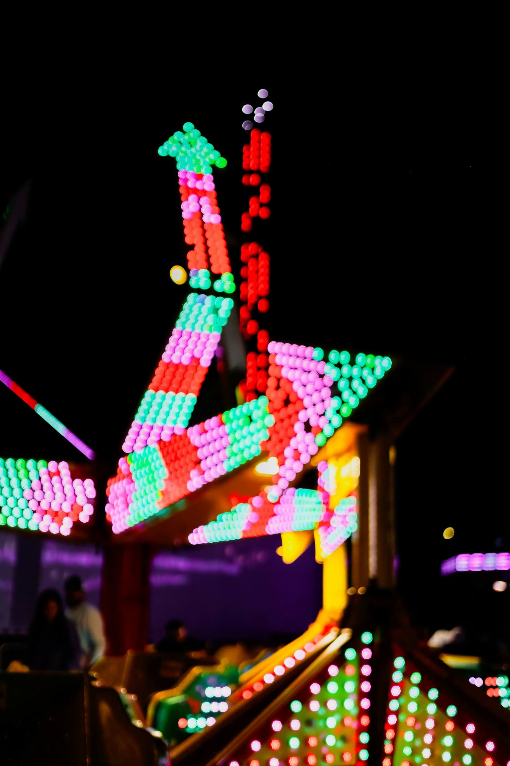 Close-up of a carnival ride at night.