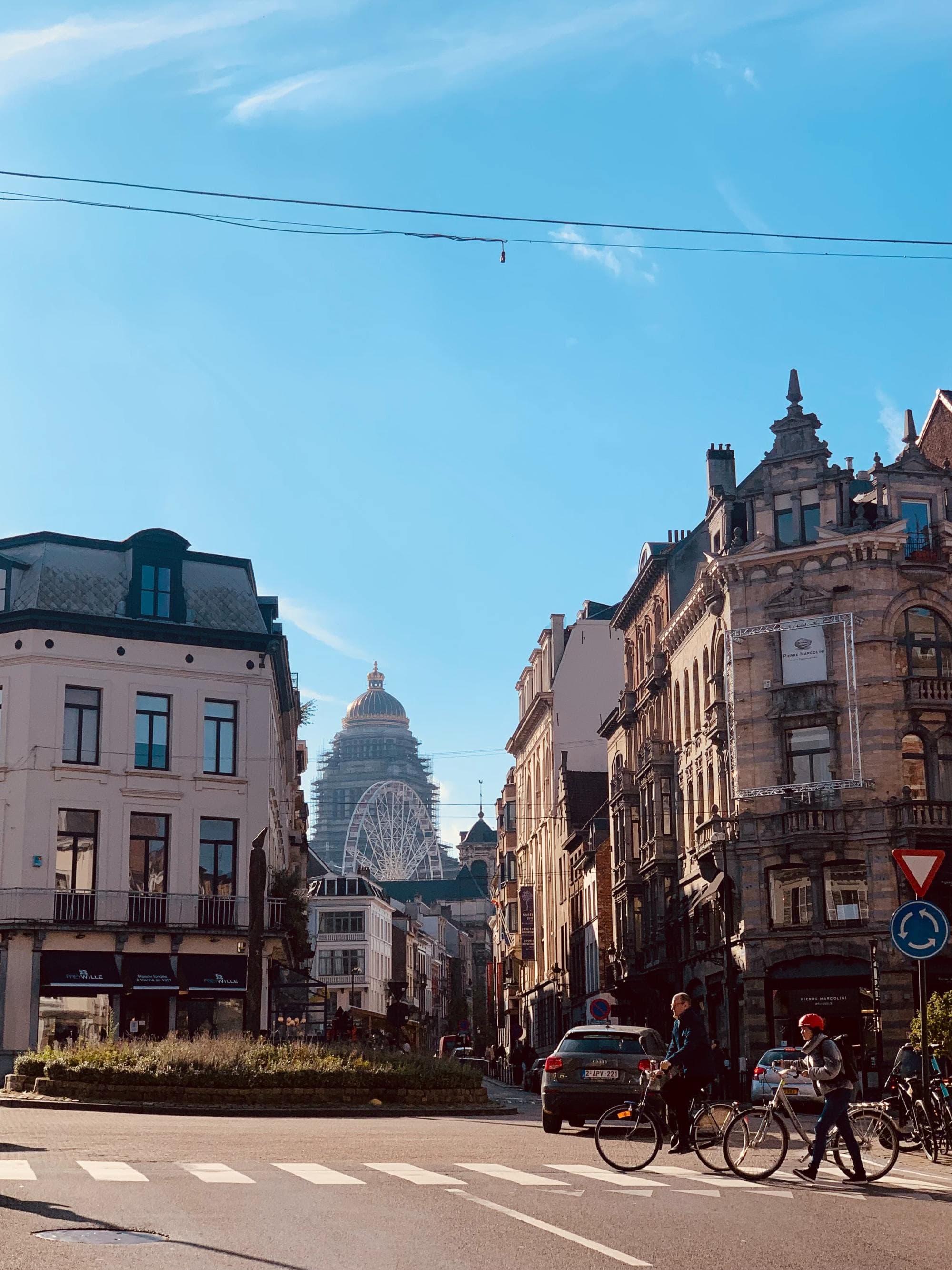 view from an intersection at the top of a city with blue cloudless sky