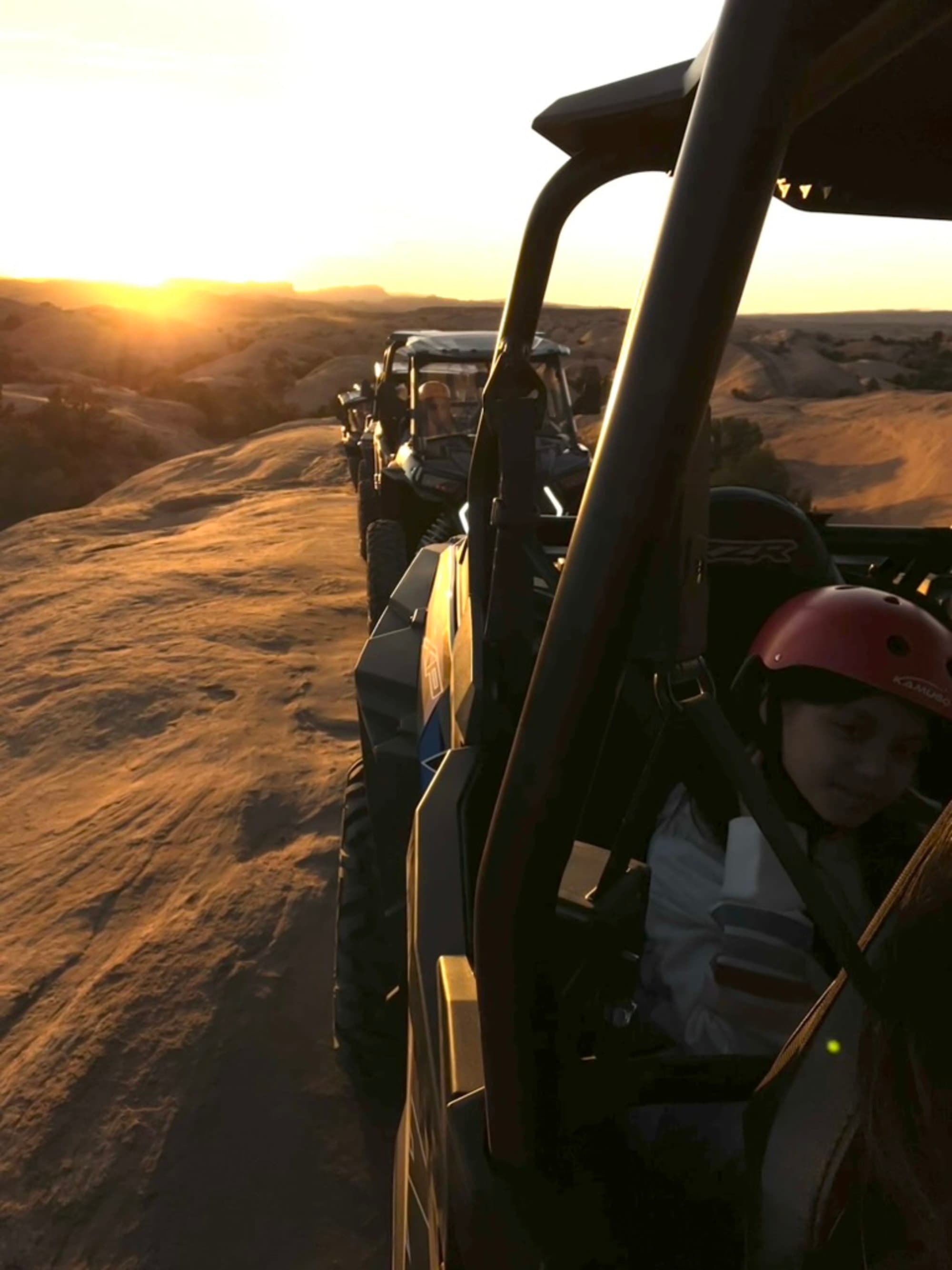 A picture of jeeps on desert sand during daytime