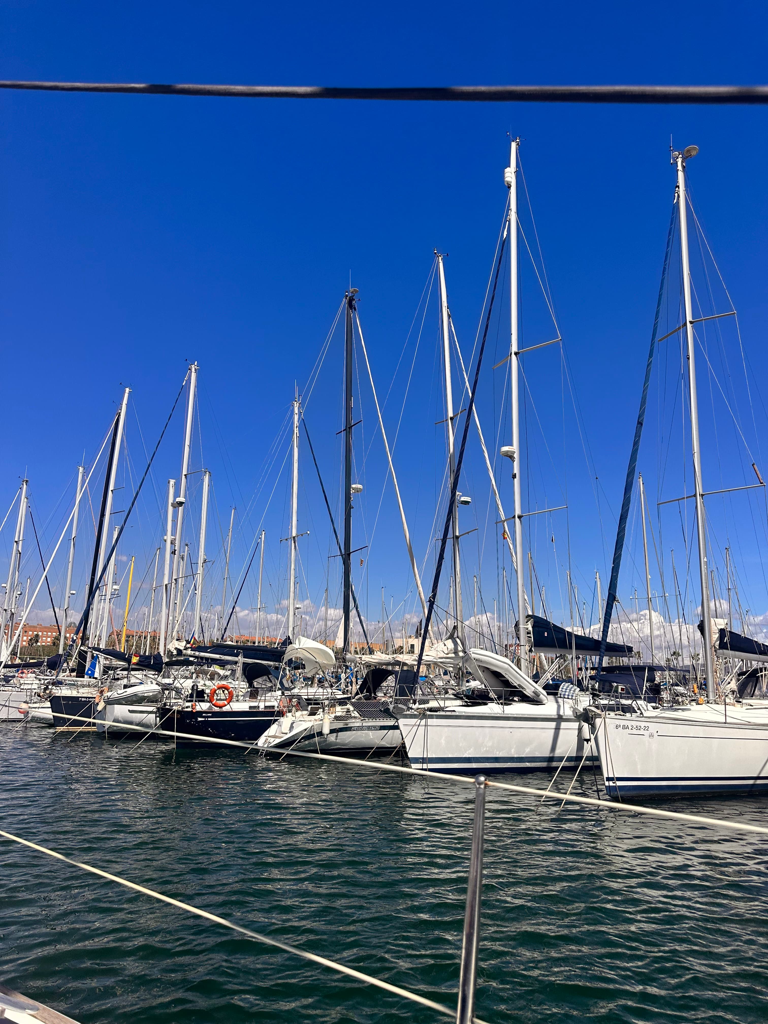 Row of boats ready for cruise at a marina in Barcelona.