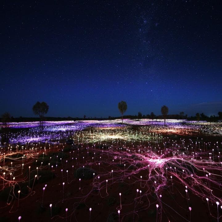 Display of lights on ground at night time.