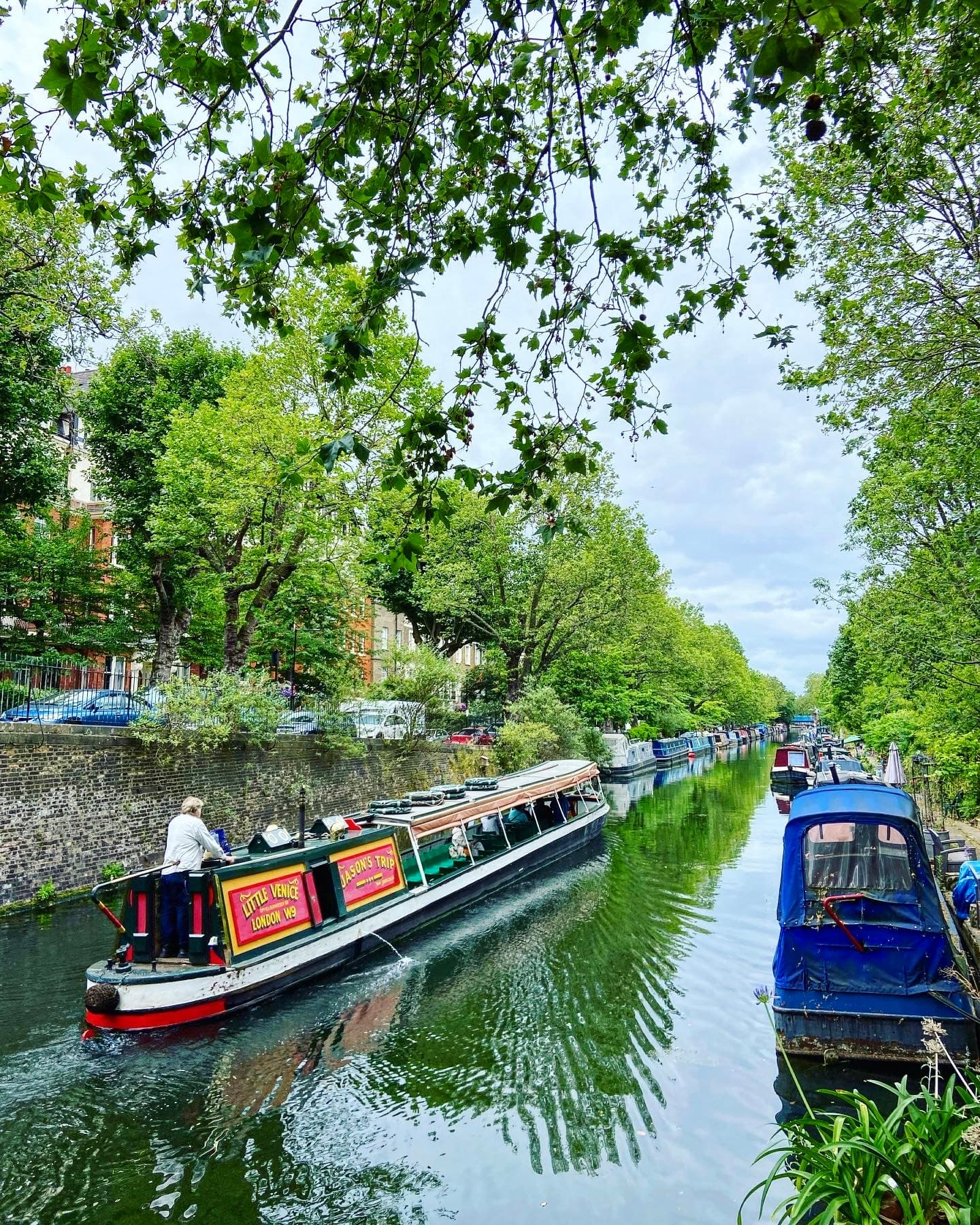 Longboats on a canal during the daytime