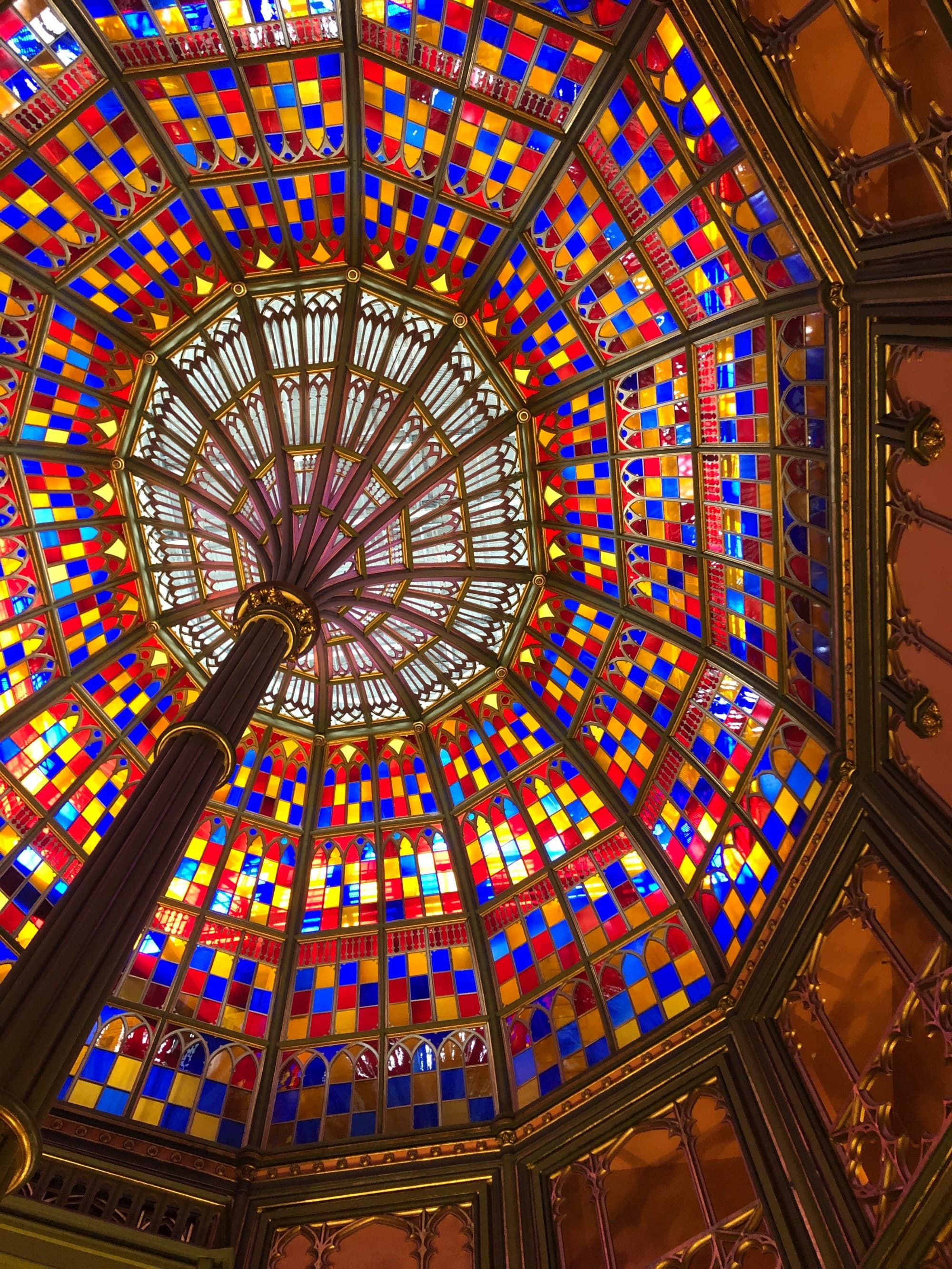 A bottom up view of a beautiful, multi-colored glass ceiling.