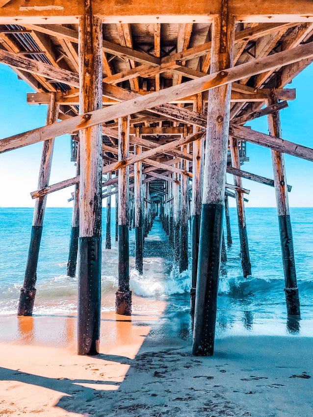 Under a wooden boardwalk on the beach