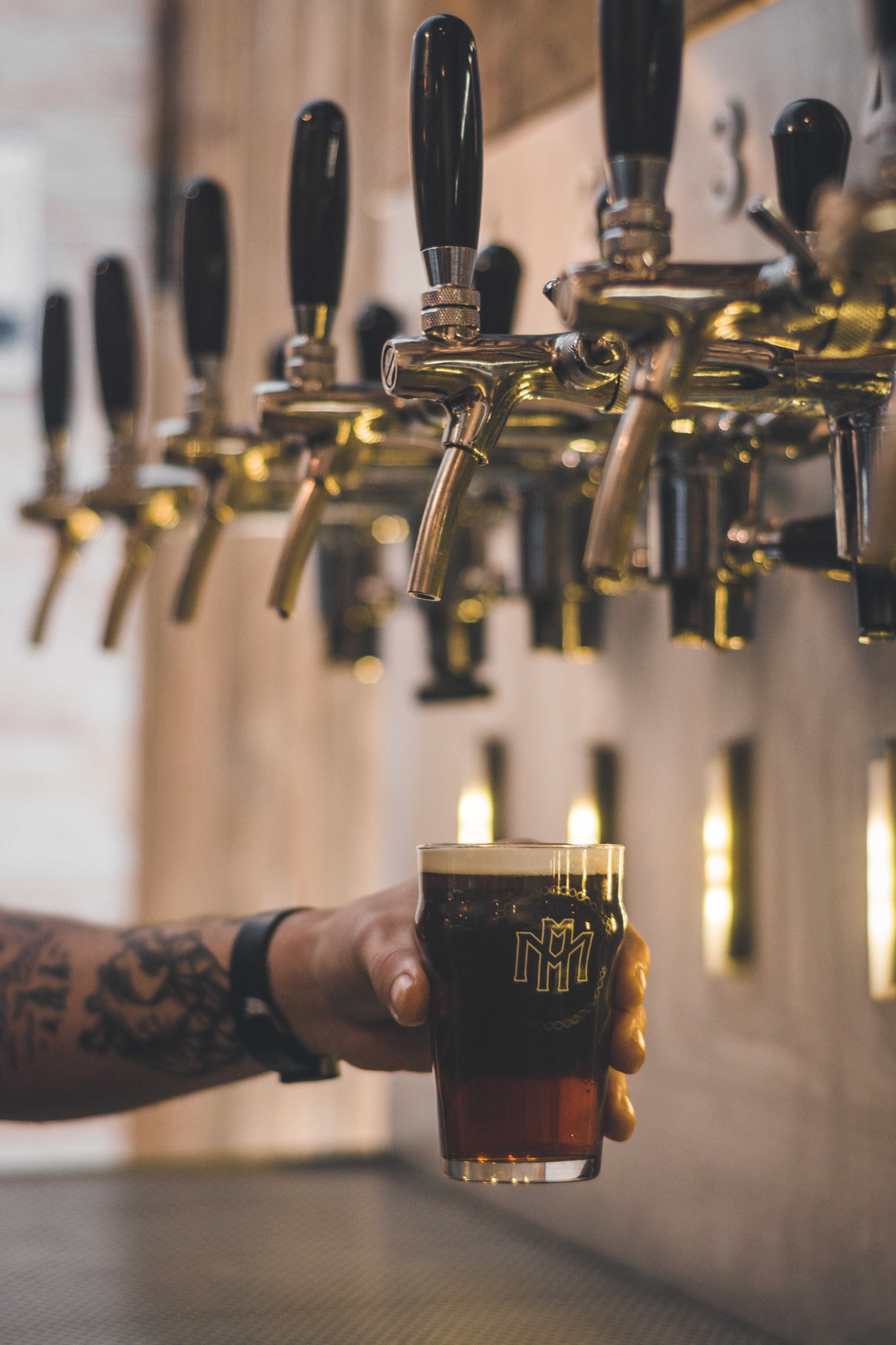 A cup of beer being filled.