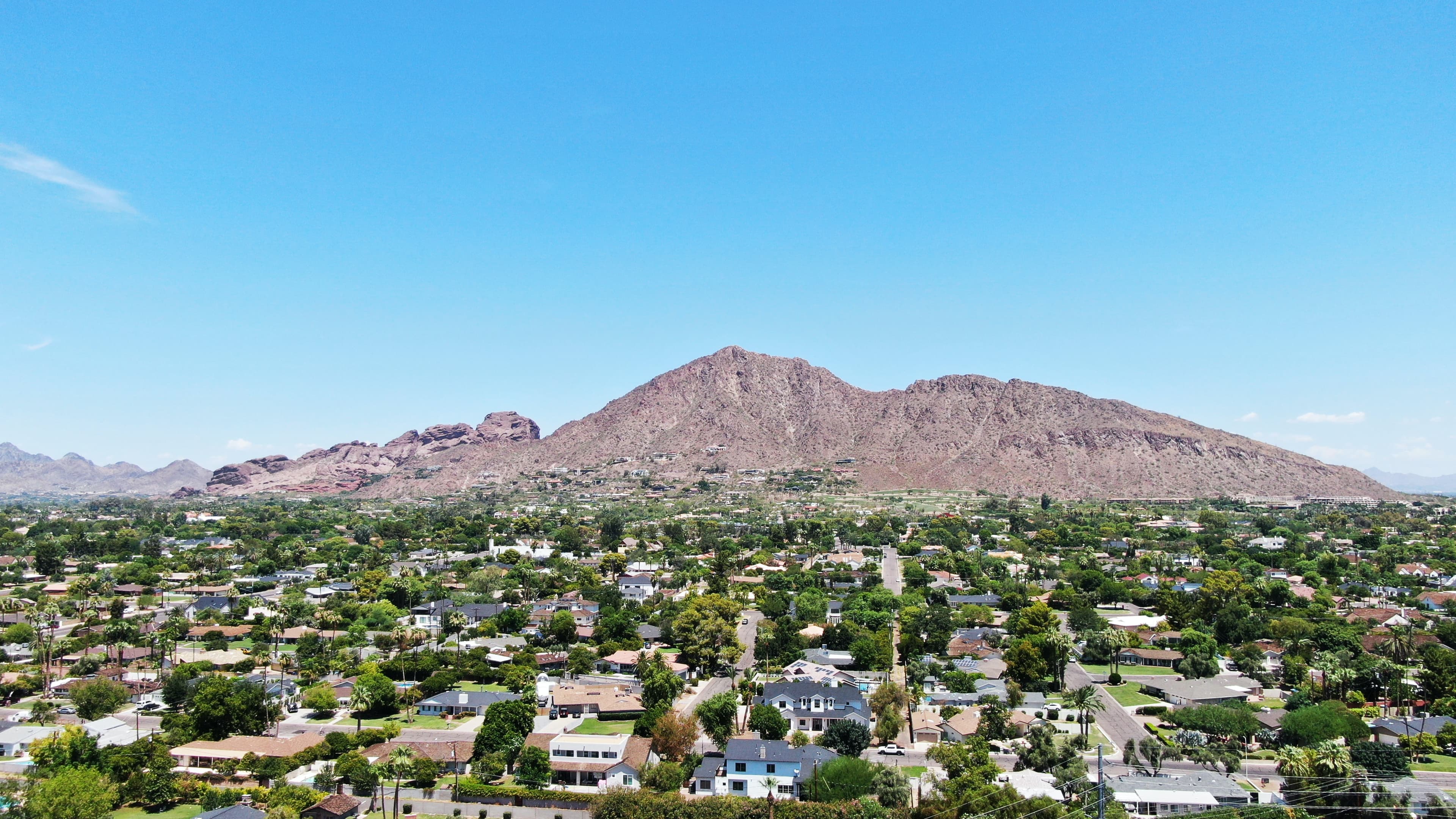 city next to mountains during daytime