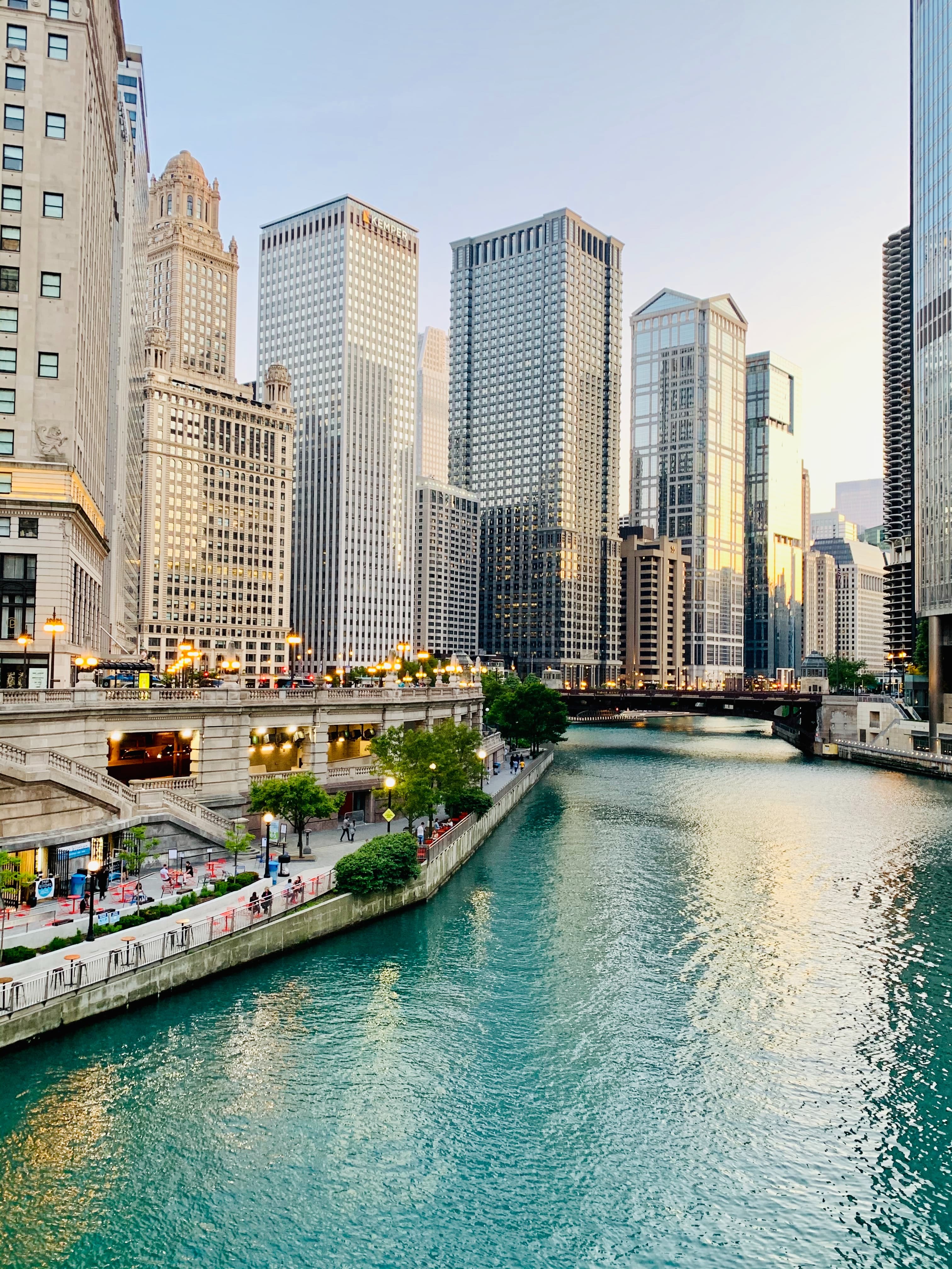 Body of water lined with tall buildings during daytime